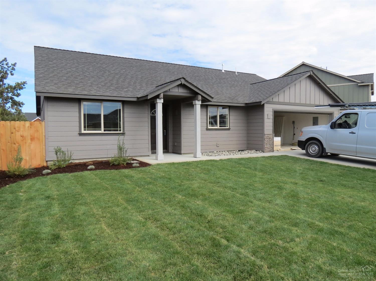 Large great room with gas fireplace opens to dining and kitchen with eating bar. Knotty Alder cabinets with quartz slab counter tops, all stainless steel appliances. 30 year roof, forced air gas that is AC ready. Separate utility room. Double car attached garage. Fully fenced, landscaped with sprinklers front and back plus RV parking.