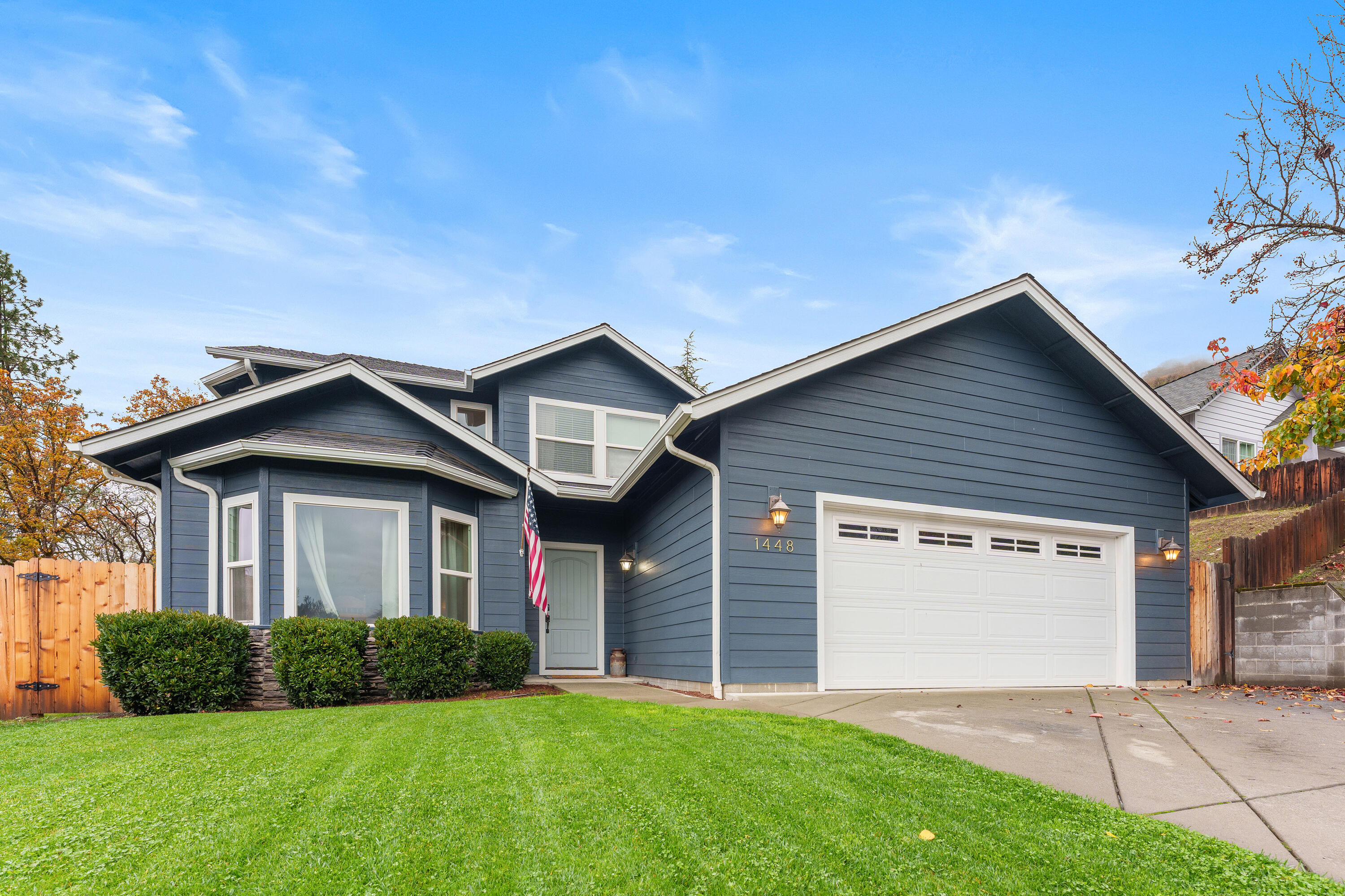 Discover this beautifully updated Northeast Grants Pass gem featuring 3 bedrooms, 2.5 baths, and a bright, open kitchen and family room perfect for gatherings. The stylish kitchen showcases a copper farmhouse sink overlooking the expansive backyard, along with sleek stainless steel appliances. Upstairs, all bedrooms enjoy peaceful views, including a spacious primary suite with walk-in closet, jetted corner tub, and separate shower. A versatile bonus room adds ideal space for an office or pantry. Built in 2004 with 1,651 sq ft, this home is tucked on a quiet cul-de-sac just minutes from parks, shopping, and District 7 schools. The inviting outdoor retreat offers a metal-roofed gazebo, generous patio for entertaining, and a refreshing above-ground pool-perfect for warm Southern Oregon summers.