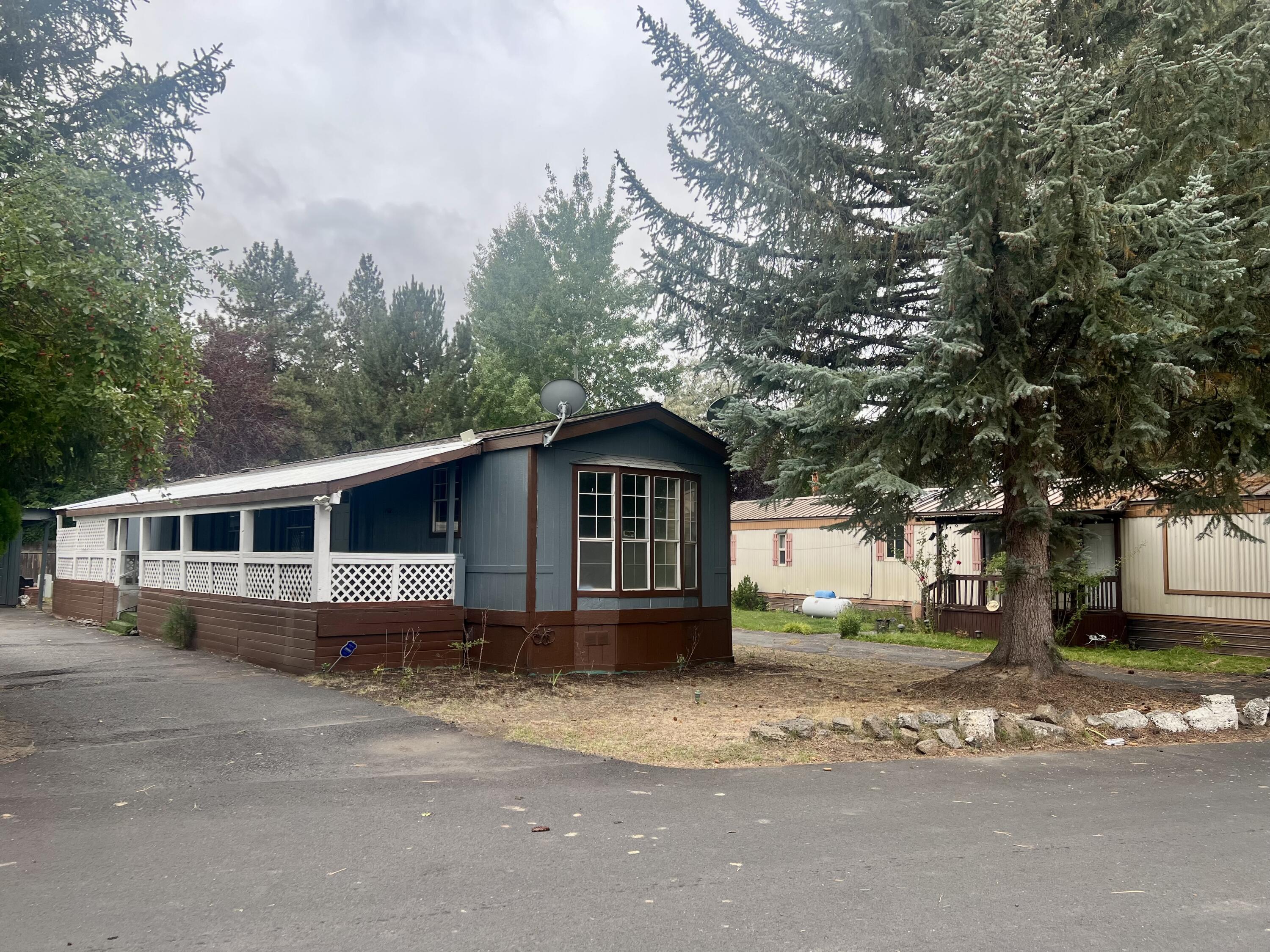 Affordable mobile home located in a family-friendly park on the east side of Bend! This home is tucked away toward the back of the park, offering extra privacy and space. It features a large driveway with plenty of room for vehicles and a spacious lot area.

The home needs some TLC, giving you the perfect opportunity to add your personal touch and make it your own. With a bit of vision and care, this property can shine again. Conveniently located near schools, new Bend library, shopping, and parks — a great chance to own an affordable home in Bend!