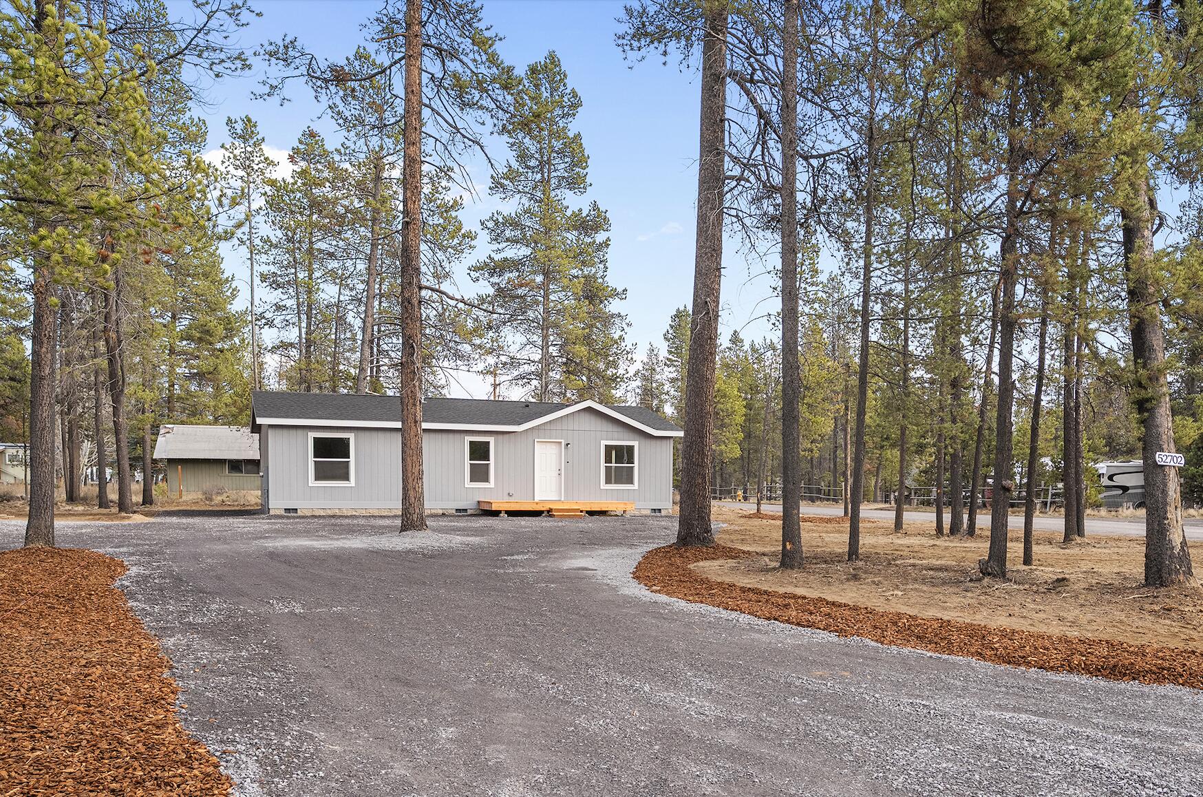 This is the most affordable brand new home on a 1/3 acre lot in Deschutes County. This move in ready 3-bed, 2-bath home offers the perfect balance of comfort, quality, and Central Oregon living. Connected to city water and sewer with quick access to Highway 97, it provides an easy commute to Bend while enjoying the space and privacy of La Pine.
The bright open concept layout connects the kitchen, living, and dining area, ideal for everyday living and entertaining. The primary suite features a private bath, with two additional bedrooms and a full bath offering flexibility for family, guests, or a home office.
Built for Central Oregon with energy-efficient construction, 2×6 walls, a snow-load roof, solid slab foundation, split-face block skirting, modern fixtures, and quality appliances. Enjoy front and back decks plus an oversized fenced yard with room for RVs, toys, a workshop, or garden. Builder offering buyer incentives, considered with acceptable offer.