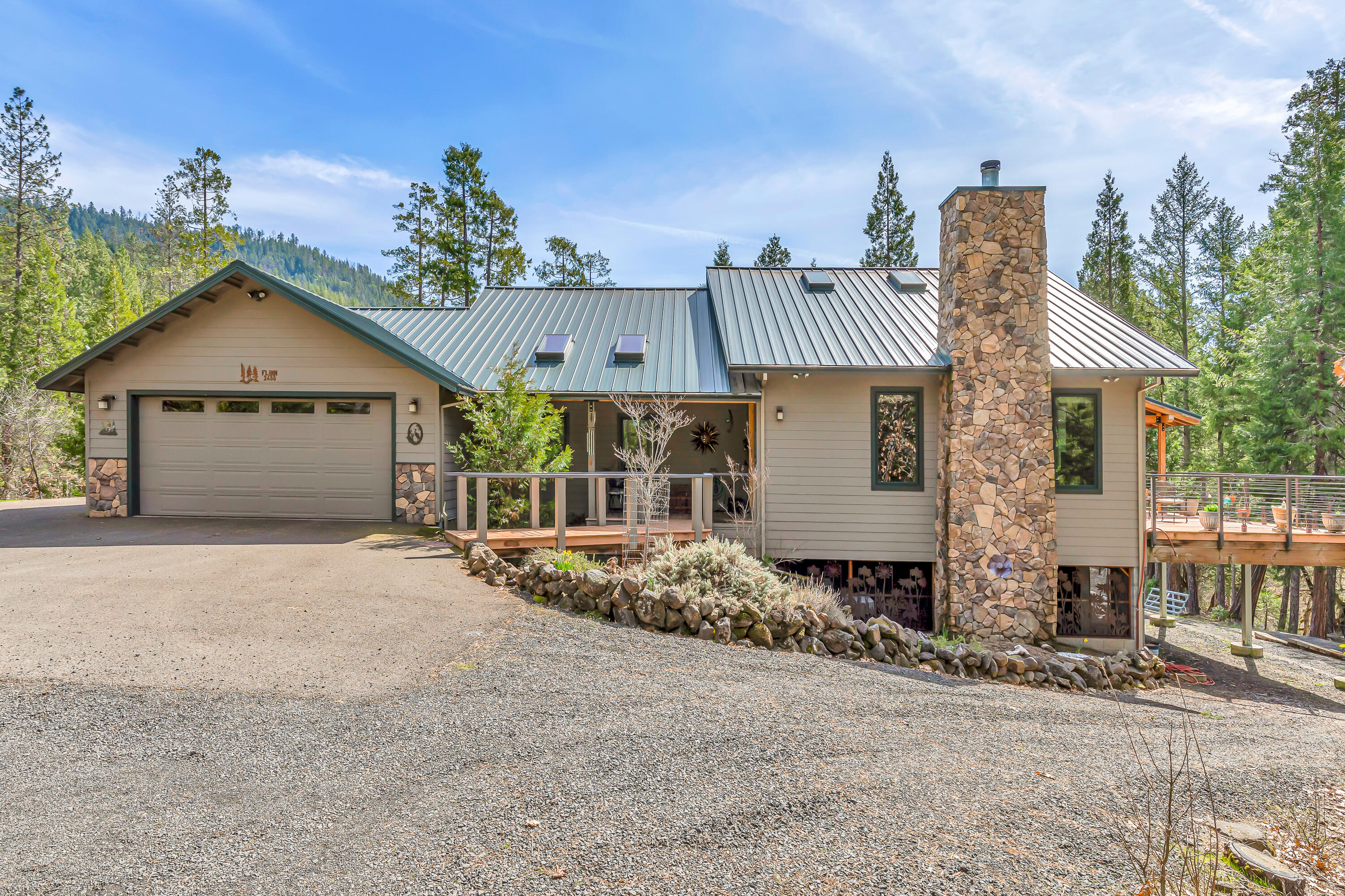 Discover an extraordinary ranch spanning 20 irrigated acres with Big Butte Creek frontage and BLM land across the creek. This exceptional Northwest home blends luxury and functionality with an innovative geothermal heating/cooling system and a robust generator ensuring uninterrupted comfort. The spacious 5-bedroom home features luxurious heated tile floors in the master bedroom, walk in closets, elegant tile shower with soaking tub. With Stunning knotty hickory cabinets and doors throughout, this custom home offers everything. You'll enjoy the private deck off the kitchen with sounds of the creek rambling below.   An oversized garage and a massive 25 x 35 insulated shop provide ample space for vehicles, equipment, and workspace. The property offers a nice pond, large meadow, towering trees and natural beauty.  Creating an ideal retreat for those seeking privacy, efficiency, and breathtaking landscape views. Careful, once you tour this home, you won't want to leave.  Oregon Dream!