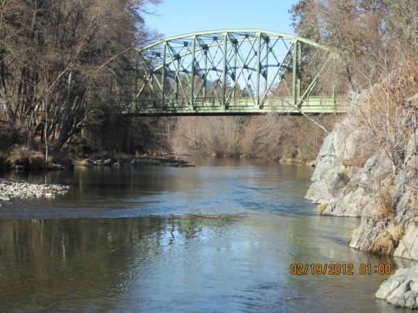 Premiere Applegate Commercial Riverfront Property Commonly known as the Applegate Wayside Park. This 1.95 acre parcel is located next to the Applegate Store,Cafe, Post Office and Oregon-Land.com office and has one of the best swimming holes on the river! It is strategically placed in the small town of Applegate. The Applegate area has been designated a vitaculture area and is rapidly becoming one of the favorite stops for wine tours. Applegate Rural Service is the zoning for this piece of perfection with a very nice manufactured home and inground sprinklers. This may be the best location in the Applegate for a tasting room or many other uses.