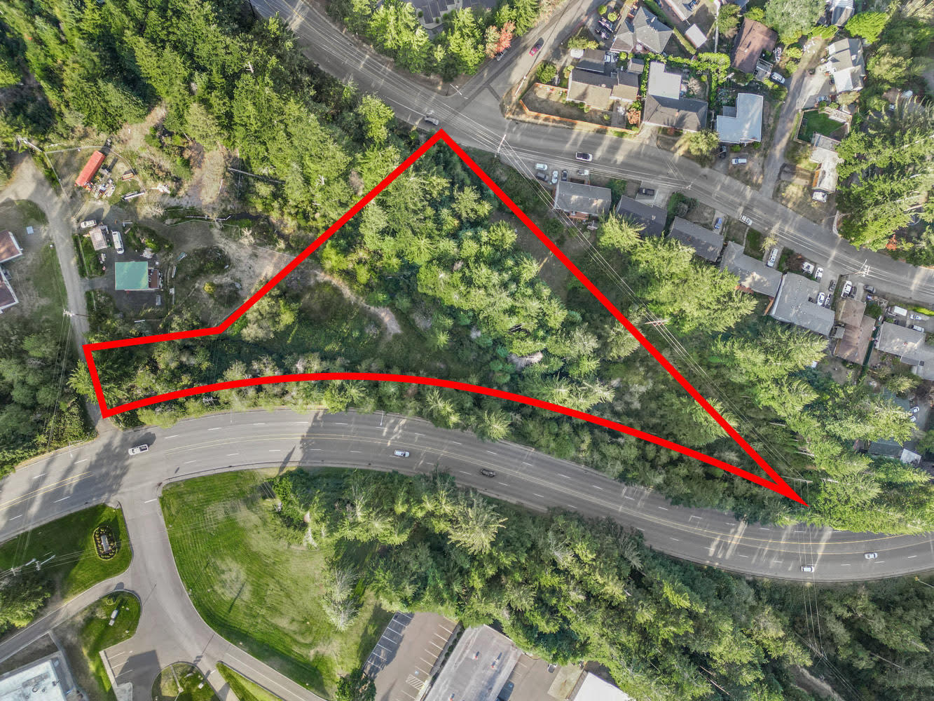 Discover the potential of this 1.51-acre multi-residential parcel, zoned R-3 and ready for development. Offering both privacy and natural beauty, the property is partially wooded with a serene creek meandering through the land. Approximately 25-40% of the site features hillside terrain, adding character and unique design opportunities. Electric, sewer, and water are conveniently available providing a head start on development. The seller has already filed permits for an access driveway and sewer connection, creating even more value for the next owner. Nestled among trees and tucked away for privacy, this property presents an ideal setting for a thoughtfully designed multi-residential project. A prime opportunity for developers or investors looking to create in a peaceful, natural environment while still enjoying essential infrastructure in place.