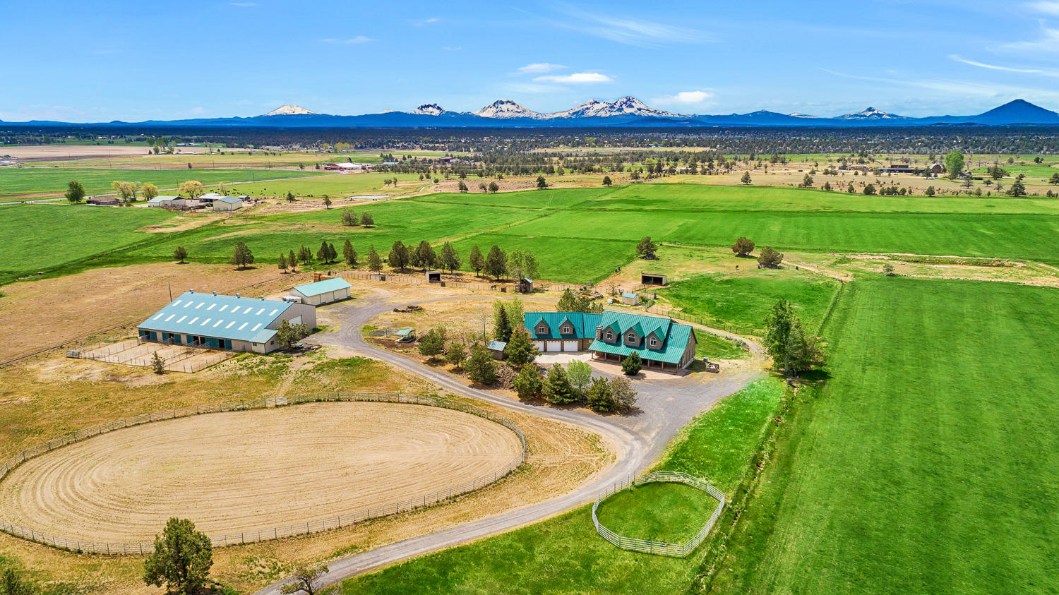 The finest quality and expert craftsmanship come together to create one of Central Oregon's finest ranch properties. Find your personal haven tucked at the base of the Cascades. Thoughtfully designed custom home is positioned on the property to maximize seclusion and commanding views of the mountains and Smith Rock. No details overlooked, enjoy main level living with open floor plan, media room, wet bar, tall ceilings, and attached 3 car garage and dramatic log accents throughout. Plenty of space to work from home, entertain, and lock off apartment has its own kitchenette, balcony, and living room. Outside find comfortable dog kennels, custom chicken coop, 3 bay shop/garage and captivating pond views. Horse facilities feature 50x100 indoor arena, outdoor arena, 8 stalls with runs, heated tack room with full bath, and round pen. Property has 60+/- acres of water rights for hay and grazing livestock. Exceptionally cared for and ready for you to experience the elegant ranch lifestyle.
