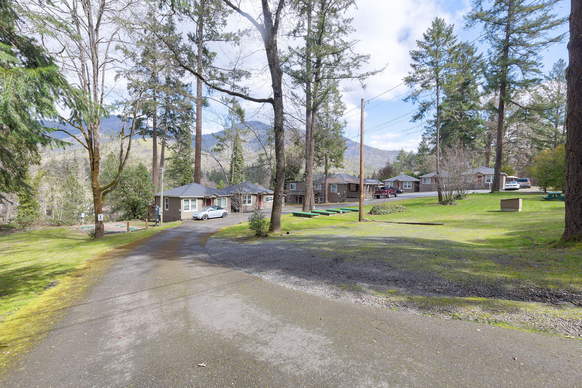 Attention investors!  Welcome to The Cottages on the Rogue!  This 9 unit property features a 3 bedroom 1 bath home great for potential manager quarters with basement along with 8 cottages that include 6 - one bed one bath, 1 - two bedroom one bath and one studio. Several units overlook the famous Rogue River with exterior decks and beautiful mountain views.  Capital improvements  include roofs, windows, natural gas heating, and completely revamped septic system.  Common area up front is great for entertaining. Units have had long term tenants, some as many as 20 years! Owner will Carry with acceptable terms! Centrally located between Grants Pass and Rogue River.  Call to schedule your tour today!