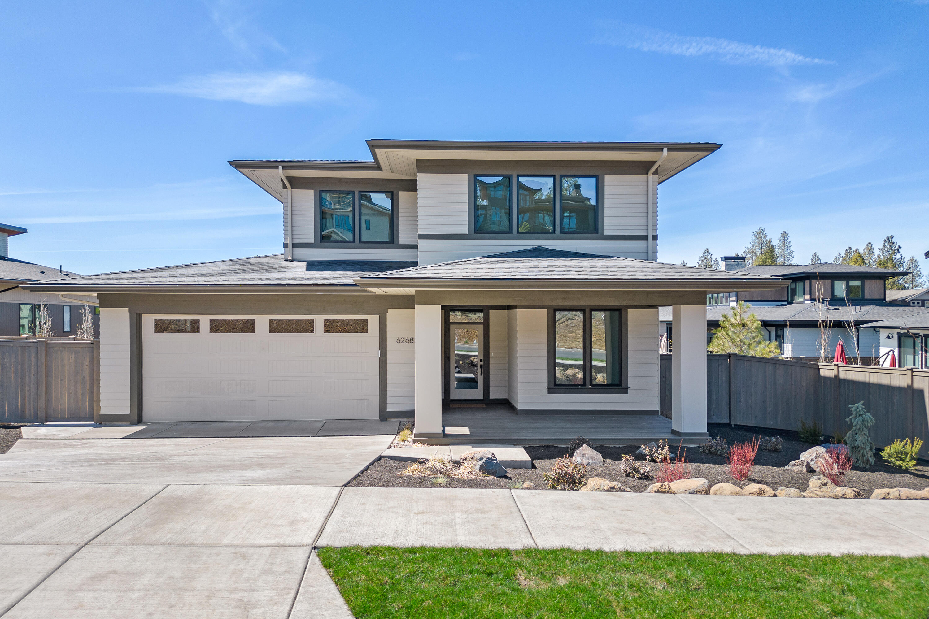 Introducing a stunning 2,537 square foot prairie-style home in Shevlin West. Boasting fresh new construction and a wealth of features, this property effortlessly combines modern comfort with aesthetic charm. Step onto the covered front porch and through the front door into a welcoming foyer opening into a spacious open floor plan. The large kitchen is a dream, fitted with an expansive island, walk-in pantry and custom cabinetry. The inviting living room, complete with a gas fireplace and custom built-ins, promises to be the perfect spot for both relaxation and entertainment. The main level also includes a versatile den and a sprawling primary suite that offers a private haven from the rest of the house. Venture upstairs to find two bedrooms, full bathroom, and a roomy bonus room. Embrace outdoor living on the covered patio for alfresco dining- while enjoying the privacy and tranquility of the expansive backyard that is fully fenced, and landscaped to perfection.