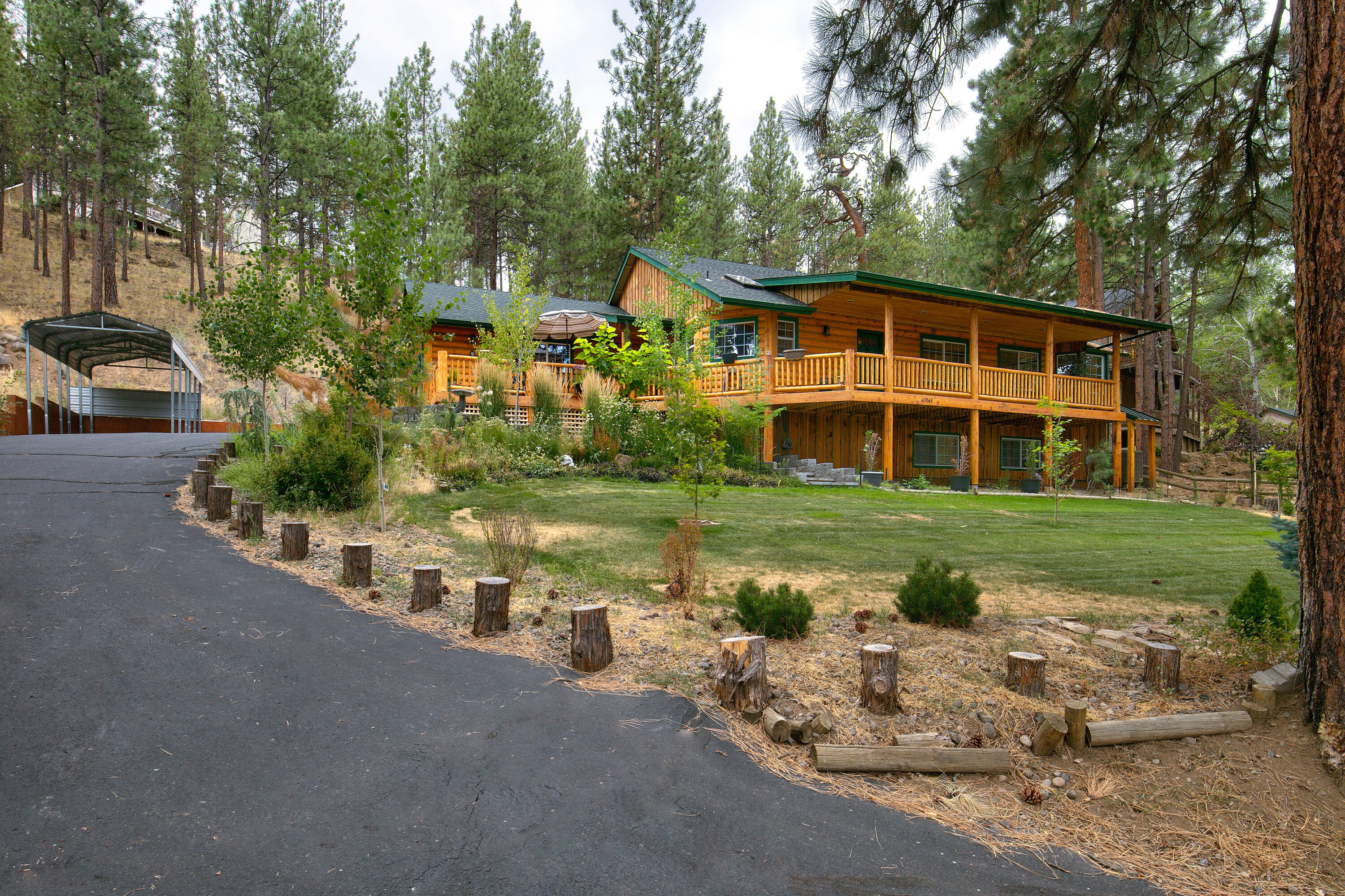 This home has it all including four bedrooms (primary bedroom on main level), two full bathrooms, light and bright kitchen open to the dining/living room with propane wood stove, laundry room with sink and attached two car garage for all your friends and family. Property fronts the Camp Polk Meadow Preserve and sits on just under one acre. Close proximity to downtown Sisters and Aspen Lakes Golf Course makes this one of Sisters' best buys!