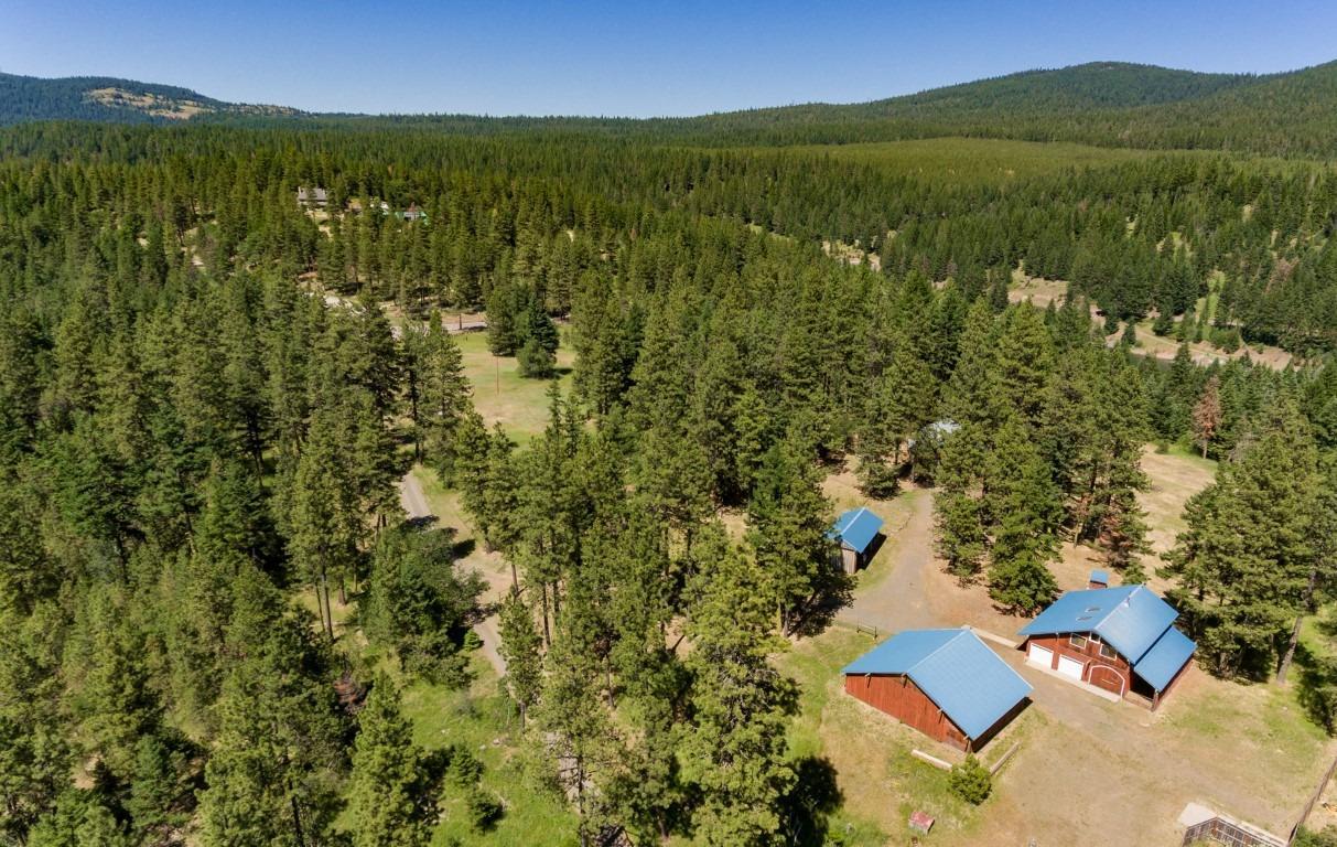 One of the most magical properties in the Greensprings! Situated on 14.76 acres at the Summit of the Greensprings & just 1 mile south of the Greensprings Inn, you will marvel at the expansive views of beautiful Southern Oregon, Pilot Rock & Mt. Ashland. The Pacific Crest & Applegate Trails pass through this pristine property which further enhances its unique beauty. The main home has an uplifting earthiness & features Bamboo flooring, soaring ceilings, wood burning stove, pine slat wall & ceiling. The kitchen has dining bar, tile counters & Fischer Paykel stainless refrigerator. 2 bedrooms, bath, laundry & enclosed porch with sauna complete the main level. Fabulous open master with large sitting area is on upper level with soaring ceiling & elevated windows for mountain views. Detached 3 car garage with workshop & upper level charming guest house is fabulous with living room, dining room, bedroom & bath. Engineered flooring, vaulted ceiling & views. 3 fenced pastures & large barn.