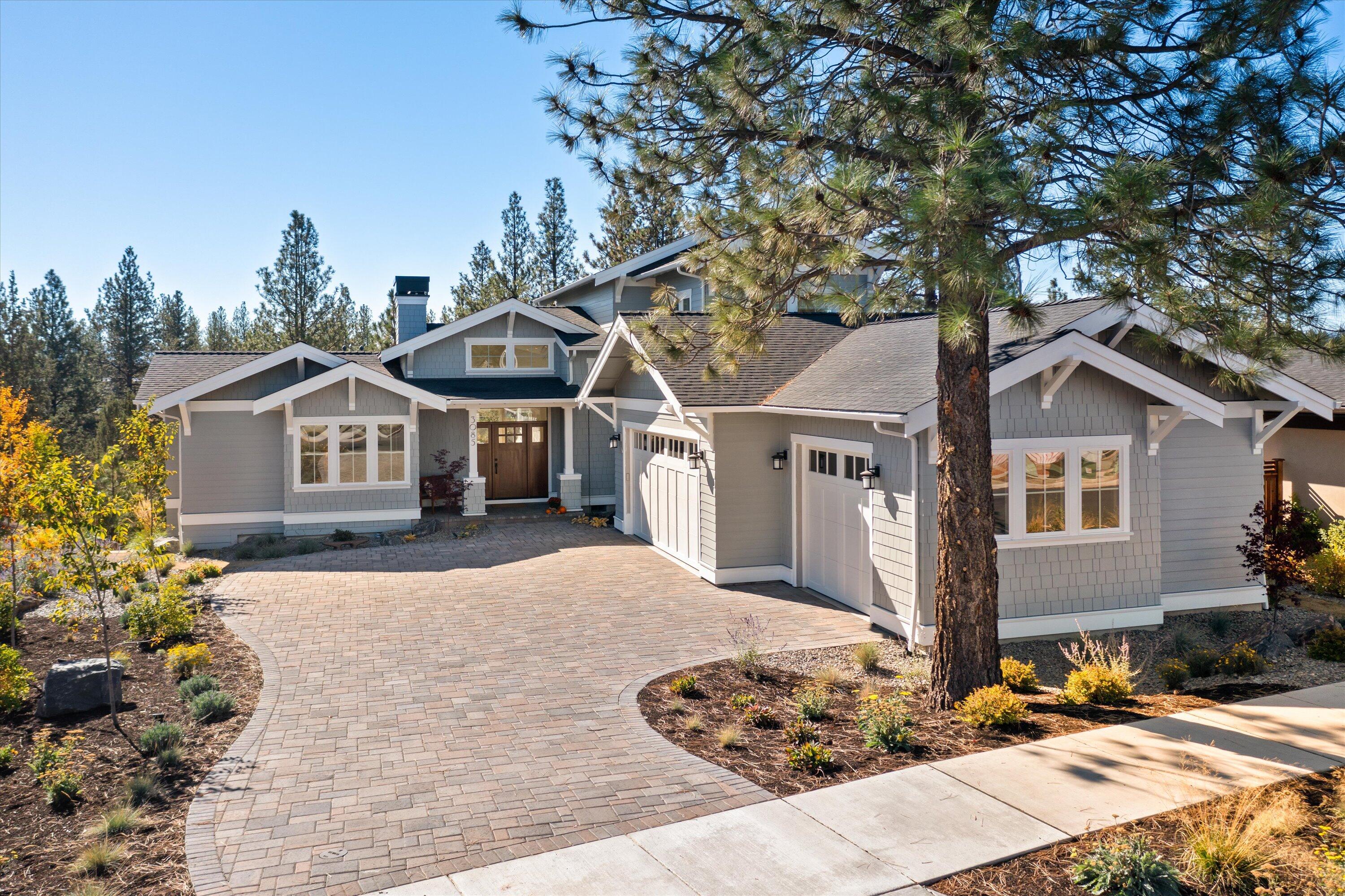 Coastal Cottage Meets Craftsman Gem in highly sought after Discovery West. 
Located on one of the largest lots, this home has a spacious great room with an impressive stacked stone fireplace & an abundance of natural light. A well-appointed kitchen with Thermador appliances, quartz countertops and a large island creates a perfect space for family gatherings & entertaining guests.
The main level features the primary bedroom with a beautifully designed en-suite bathroom w/ heated floors and a spacious walk-in closet. Additionally, an office on the main floor is ideal for remote work or flex space.
Upstairs, there are 2 more comfortable bedrooms and a full bath. 
Step outside to your private oasis, where you can relax and unwind while enjoying the protected forest views.
Below grade bonus 328 sf flex space.
The long paver driveway complements the architectural beauty of the home.
Car enthusiasts will delight in the massive 947 sf garage, complete with a car lift.