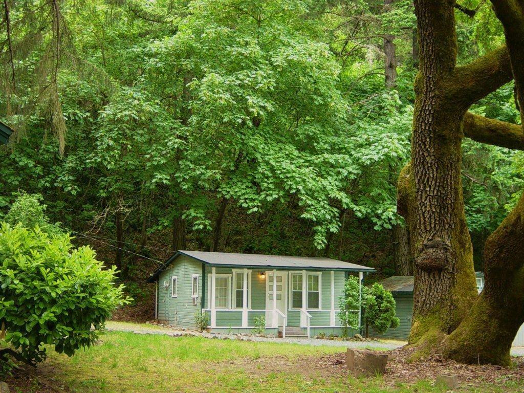 These 12 individual 1 & 2 bedroom cottages also include a 3 bedroom home all set on an 8 acre park-like setting. Property is conveniently located in Grants Pass and constantly attracts tenants due to its beautiful grounds and beautifully maintained landscaping. An Oregon dream rental property with a stable rental and income history. The current owners are offsite but maintain pride of ownership. The interiors of the cottages are unique and updated. 100% occupancy; many tenants have resided there for many years. There is a nice community laundry facility with new coin-op washers and dryers. Many new roofs, new rain gutters, Irrigation for watering, great well, several fenced yards and updated interiors, common area. New ductless mini split HVAC units.