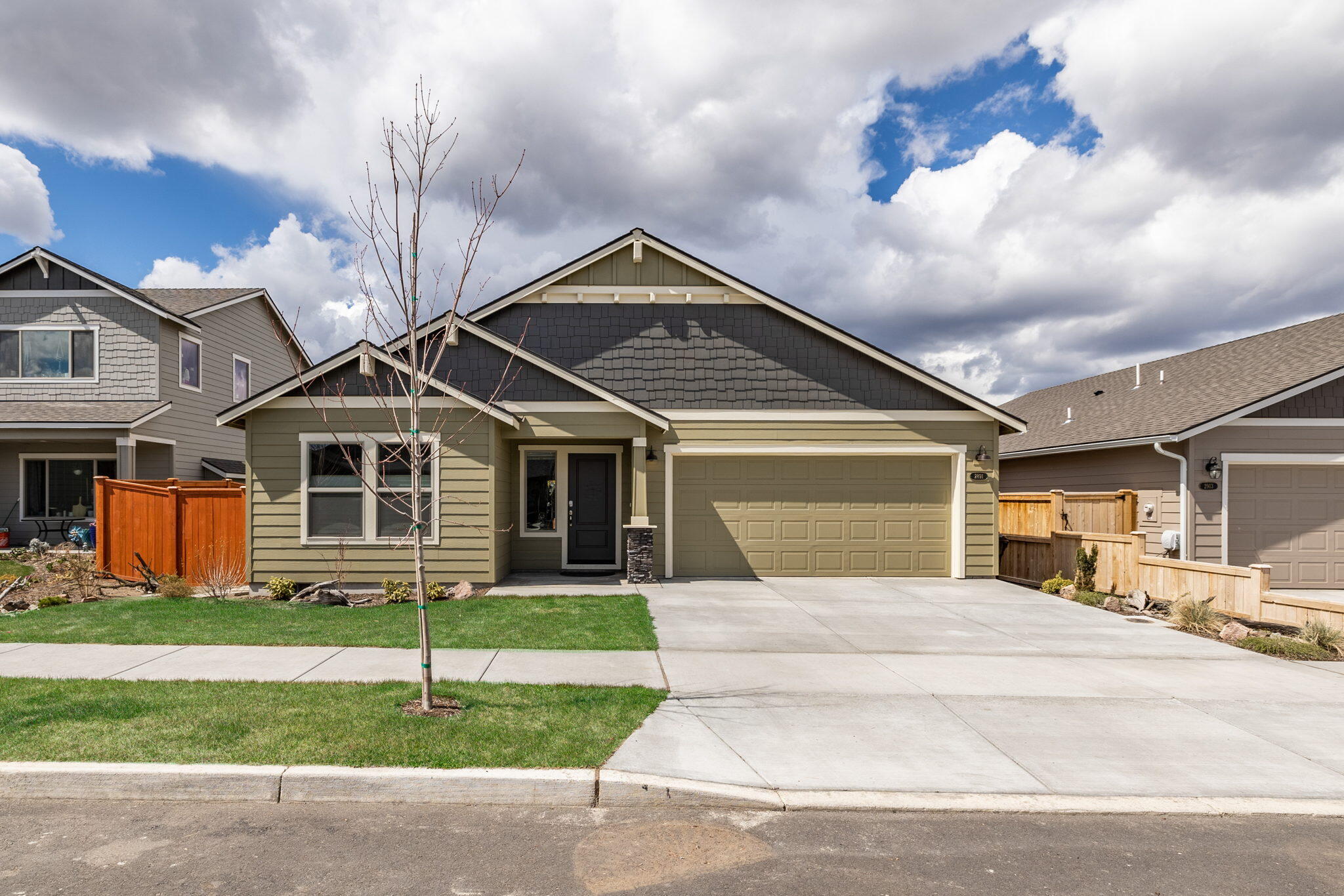 This clean and tidy home in a quiet new NW Redmond neighborhood is very near brand new itself! With an airy, open floor plan, you'll easily be able to see yourself gathering around the gorgeous kitchen island with guests. Many upgrades to be found throughout the house, including quartz slab countertops, glass tile backsplashes, water/scratch-proof luxury vinyl flooring, covered porch, custom shades, and a utility wash station. The double doors on the third bedroom lend themselves to a use as a perfect office or media space. The master suite with ceiling fan, soaker tub in master bath, and plenty of space is a home owner's oasis after a long day, and the closed off extra bedroom and laundry area is a great privacy feature too.