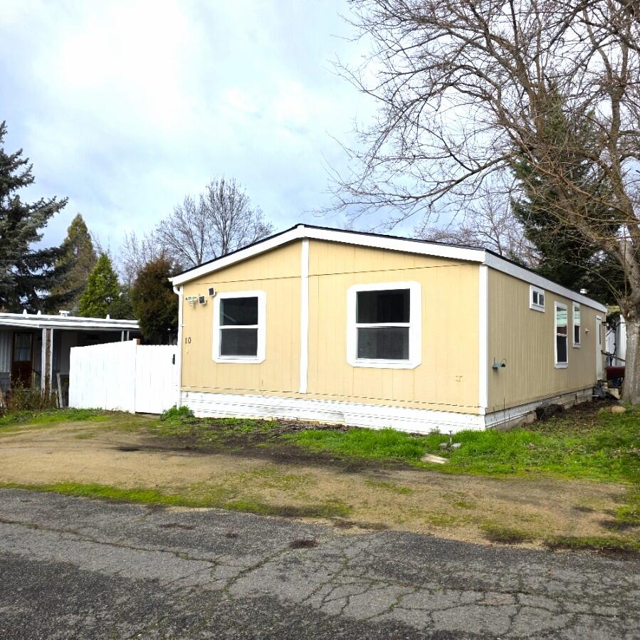 Don't miss this Ashland find, 3 bedroom 2 bath updated, freshly painted, and move-in ready. Conveniently located just minutes from the freeway with easy access to both Ashland and Medford. Enjoy a private backyard retreat featuring a deck tucked beneath a mature shade tree, perfect for relaxing or entertaining. A rare blend of location, updates, and outdoor appeal. This one is easy to love!