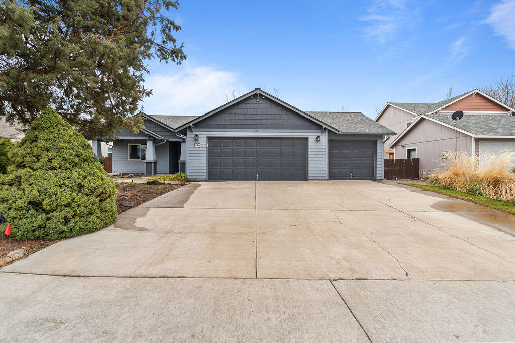 Well-maintained and move-in ready, this NW Redmond home is loaded with extras. From the three car garage to the covered patio with wood burning fireplace and the glass-enclosed greenhouse, you'll be pleasantly surprised at every turn. A covered front porch opens to a vaulted main living area with hardwood entry & freshly cleaned carpets. Just beyond, an efficient kitchen with abundant cabinets & stainless steel KitchenAid appliances shares space with a family room, eating area & easy access to the full-length covered back patio. With a real wood burning fireplace, tongue & groove ceiling & multiple ceiling fans, this patio will be your go-to hangout in every season. The large primary suite, which also opens to the patio, includes walk-in closet & renovated bath with tile floors, dual vanity & full tile shower. Mature evergreens grow along the perimeter in this private, fenced yard that encompasses the patio & greenhouse, plus lawn & garden areas. Put this one at the top of your list!