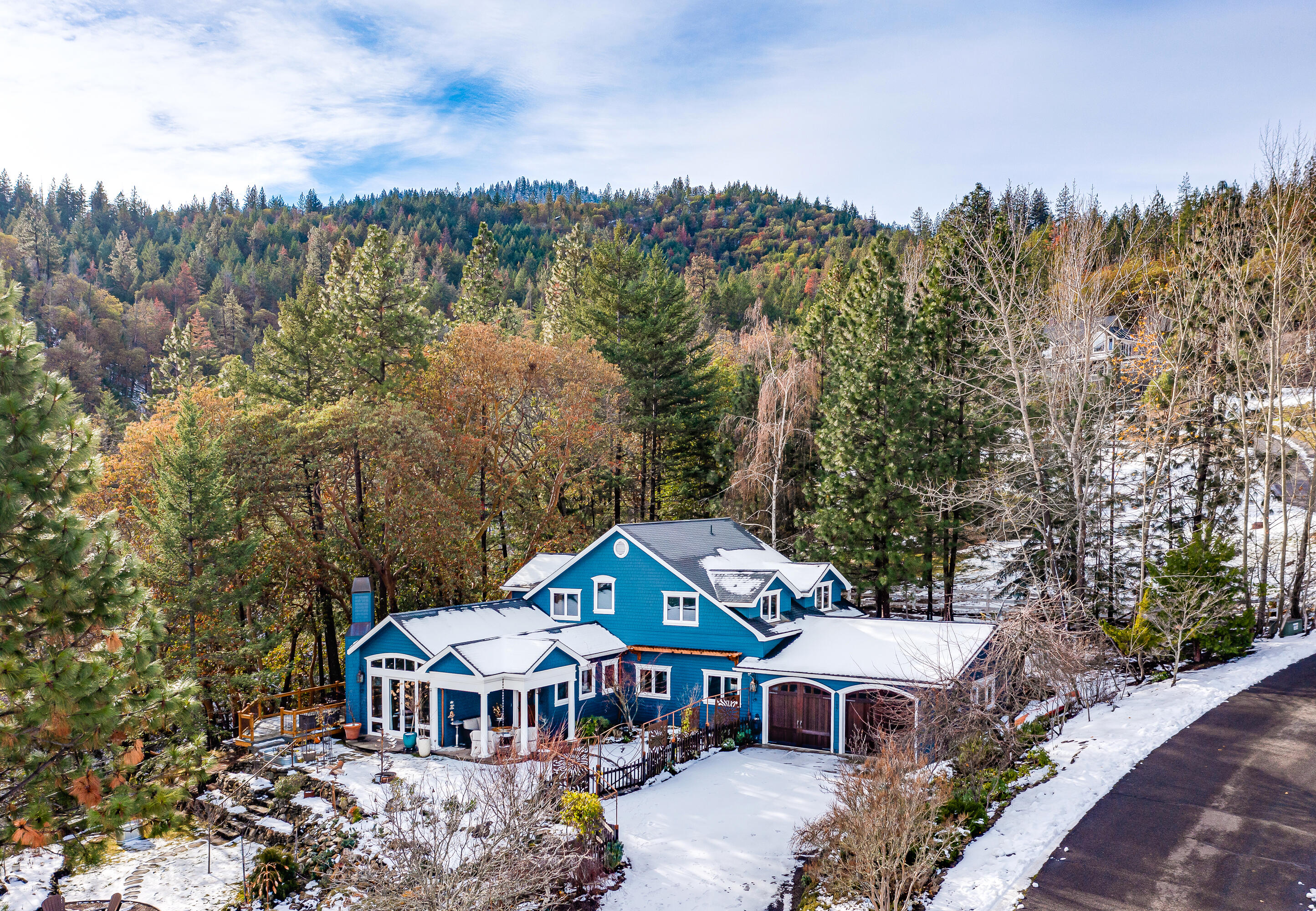 Stylish and thoughtfully upgraded home on private acreage with serene landscaping nearby the Ordeson Todd Woods — only 8 minutes from downtown Ashland! Recent improvements include new designer lighting and window coverings, ductless mini-split cassette system, new kitchen appliances, updated bathrooms, interior and exterior paint, new carpeting, along with refinished solid oak flooring, cabinetry, and Ipe deck. Main level features a primary suite with dual vanity, marble counter and shower, slipper tub, great room with limestone hearth and walnut mantle, solarium dining area, gourmet kitchen with 6-burner Wolf range, baking area with convection oven, office, half-bath, laundry/mud room, and oversized 2-car garage. Upper level with three bedrooms and full renovated bathroom. Terraced grounds with natural stone walls, deer-fenced garden with seasonal plantings, multiple sitting areas, mountain views, meandering pathways and trails, mature trees, and outbuildings. Inquire for details!