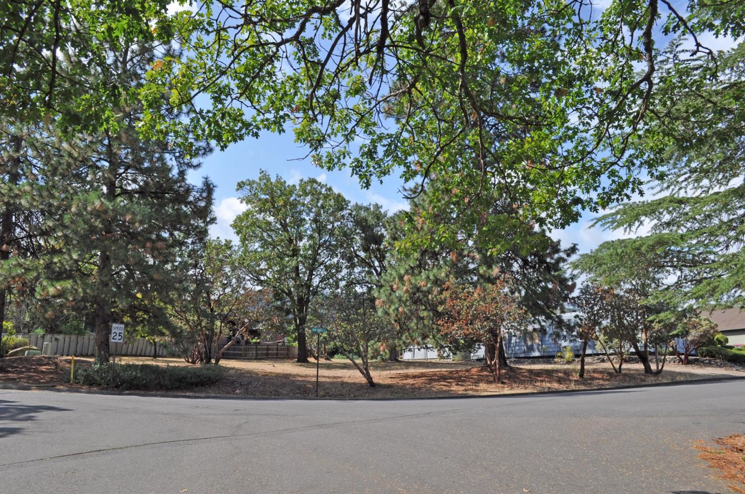 Rare, flat building lot with mature trees in established and centrally located Oak Knoll neighborhood of Ashland, just 200 meters from the Oak Knoll Golf Course clubhouse. The recently surveyed 0.24 acre parcel is adjacent to common area/open space. City services/utilities available. Per Oak Knoll Golf Course website, Since 1927, golfers of all abilities have appreciated our challenging layout and beautiful setting. Owned and operated by Ashland Parks & Recreation Commission, Oak Knoll is Southern Oregon's only municipal golf course we are truly an integral part of the Ashland community. Not a golfer? Come over and enjoy the views of Grizzly Peak and Pilot Rock from our clubhouse patio.''