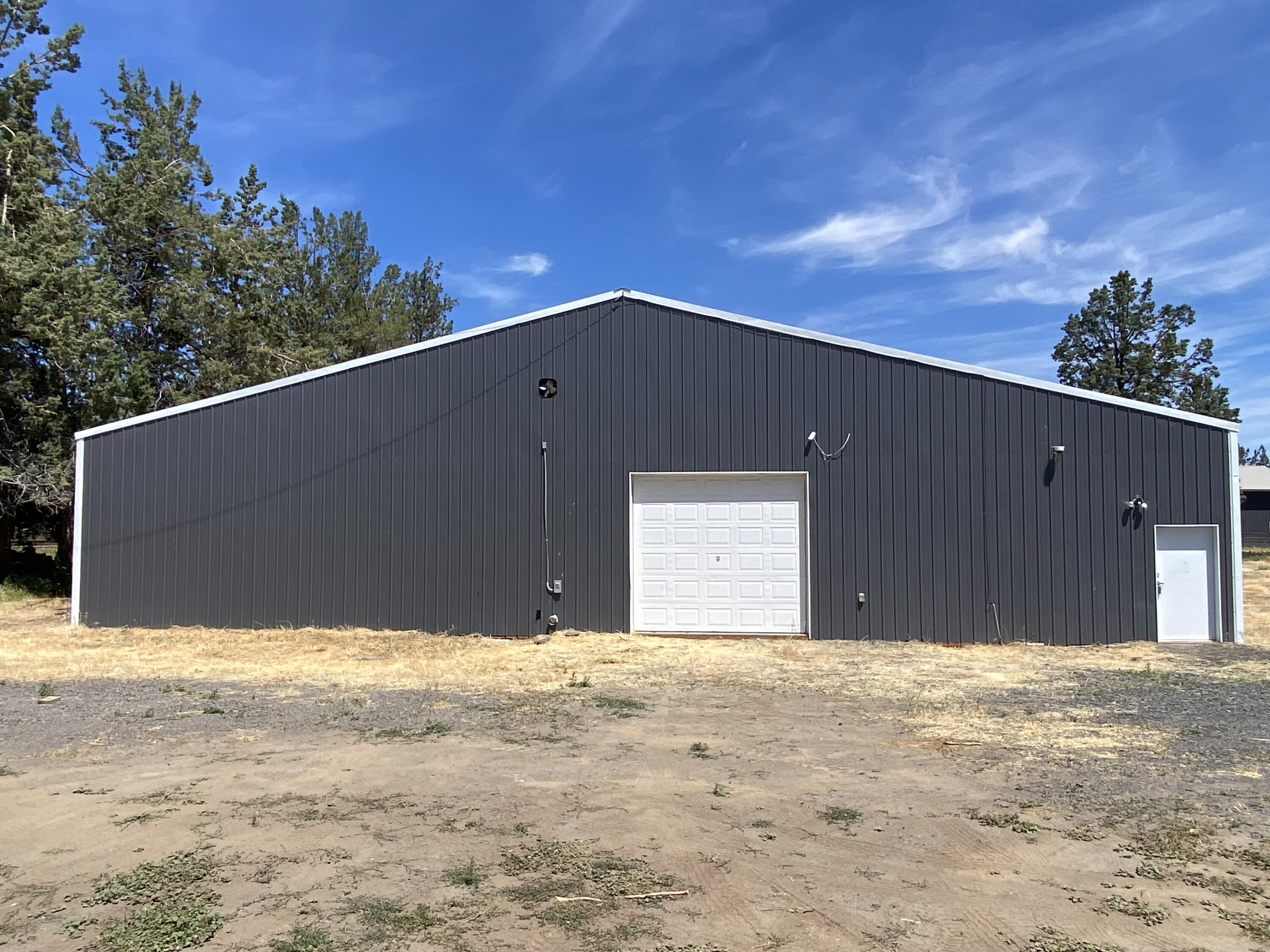 Bring Offers, price reduced $50,000! Great opportunity to own a stunning irrigated panoramic view property that includes a huge 5,184sq ft shop w/over $300k in HVAC, & electrical upgrades! Property features absolutely gorgeous Cascade mountain, Powell Butte, & lush pasture views! Already approved home site & standard septic system & homesite has a separate power panel installed. A high producing private well & newer well house w/pressure tank included. The shop has been partitioned in several rooms that can easily be reconfigured to cater to individual uses. It includes; concrete floors, commercial 3 phase power, top of the line individually zoned HVAC systems w/heating & cooling, security system, & roll up door. The pasture is irrigated w/COID irrigation & includes a 1.5hp pump. Great SW location is minutes from town w/easy access to Bend & Hwy 126, & only 1,600ft from the Deschutes River. Plans for a 2,846sq ft single level home w/open floor plan included!