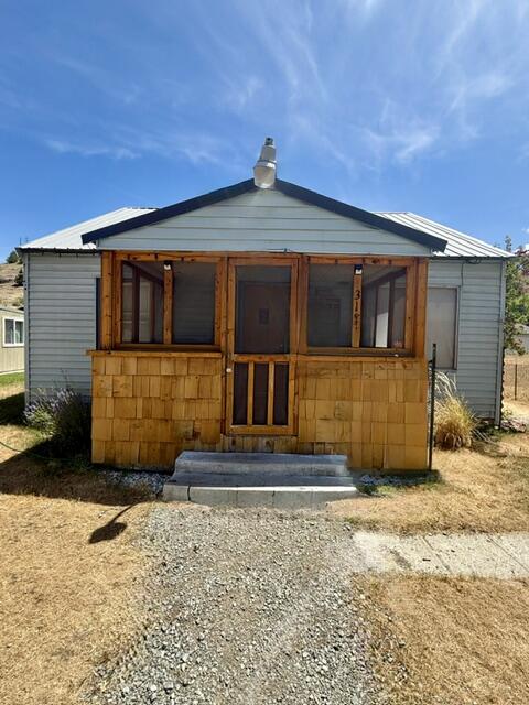 Full of character and potential, this charming 1937 cottage offers 1,204 sqft of living space. With two full bedrooms and one bathroom, the home features original vintage kitchen cabinets that highlight its nostalgic charm. Upstairs, you'll find a large bonus area with the potential for a third bedroom, offering added flexibility and value. Whether you're refreshing its classic details or customizing it to fit your style. this fixer upper is a great opportunity to make it your own. Enjoy the covered front patio, off street parking in the rear, and a spacious storage shed for added convenience.