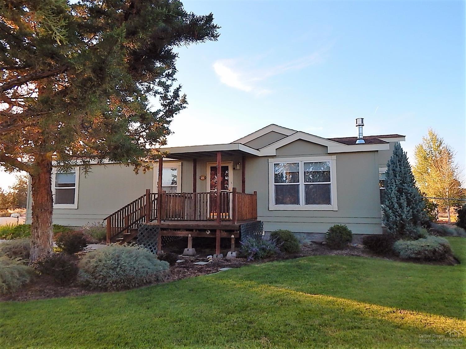 Beautiful, newer manufactured home w/detached 1120sf garage/shop area on 5.14 ac. This home is on paved road, close to the entrance of CRR ranch. Yard is nicely landscaped, fenced in the backyard with lg deck, garden area & room for a hot tub. Interior has propane stove, ceiling fans, all bd have walk-in closets, separate laundry rm with sink, lg kitchen w/island & formal dining rm area. Enjoy this wonderful community at CRR with:golf, tennis, disc golf, pickle ball, saltwater pool, riding trails & fishing!