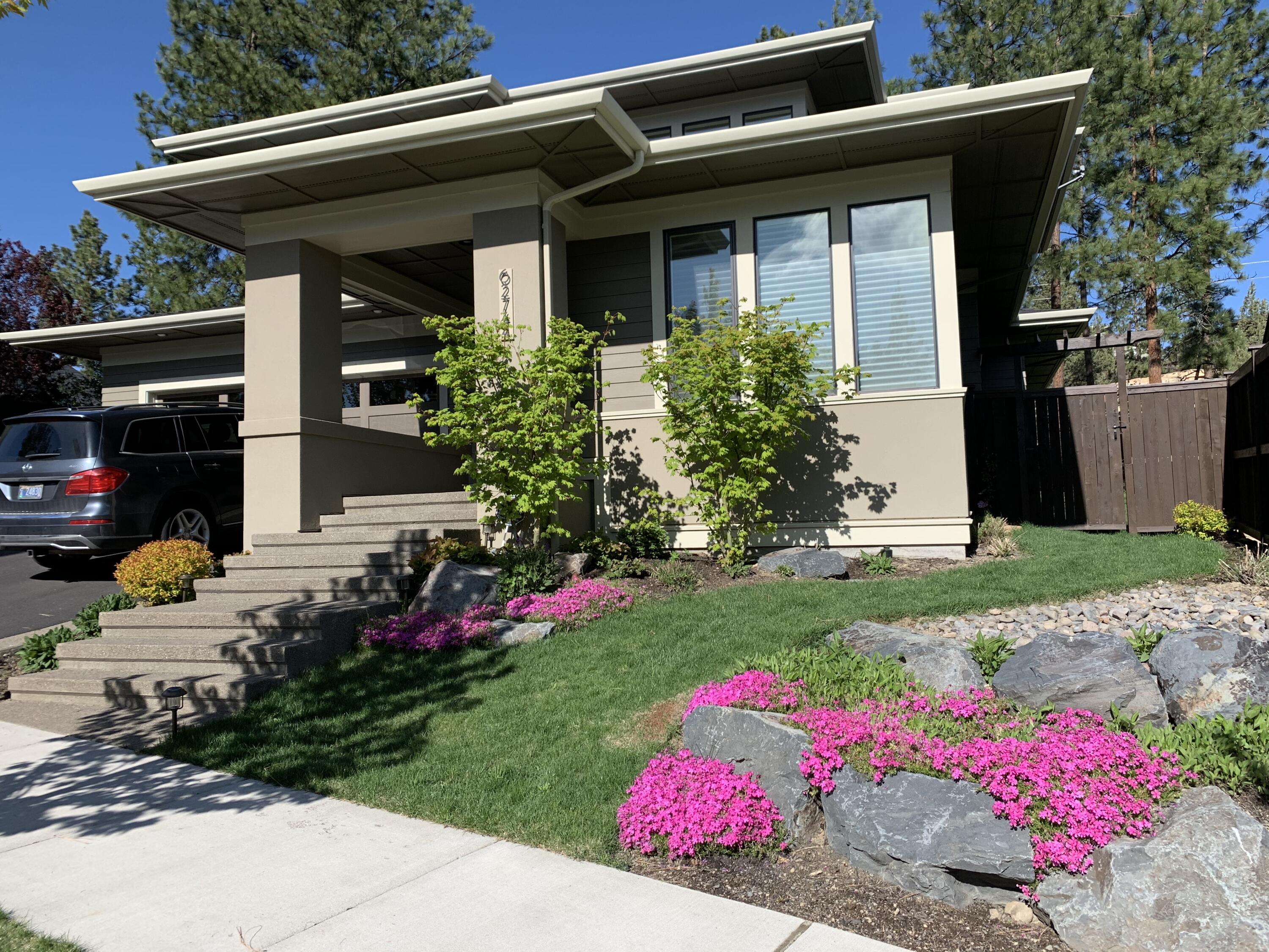 Westside Bend neighborhood with large lot and additional easement making the back yard even bigger! Prairie style home with contemporary features & covered outdoor living area. Vaulted entry, spacious great room with abundant natural light, fireplace & custom built-ins. Hardwood floors throughout main living area. Kitchen with slab quartz counters, large island, commercial style range & hood. Master suite on main floor. Master bath with large tile shower & floor. Bedroom & full bath on main floor. Bonus room, 2 bedrooms & full bath upstairs. Laundry with built-ins. Backyard designed and landscaped by professional landscape architect. Paver patios, gazebo and outdoor lighting makes the evenings even more enjoyable. Hot Tub included. Near Shevlin Park and Tumalo Creek. Seller purchased additional 80x20 piece of land behind property as a permanent easement.  See additional documentation.