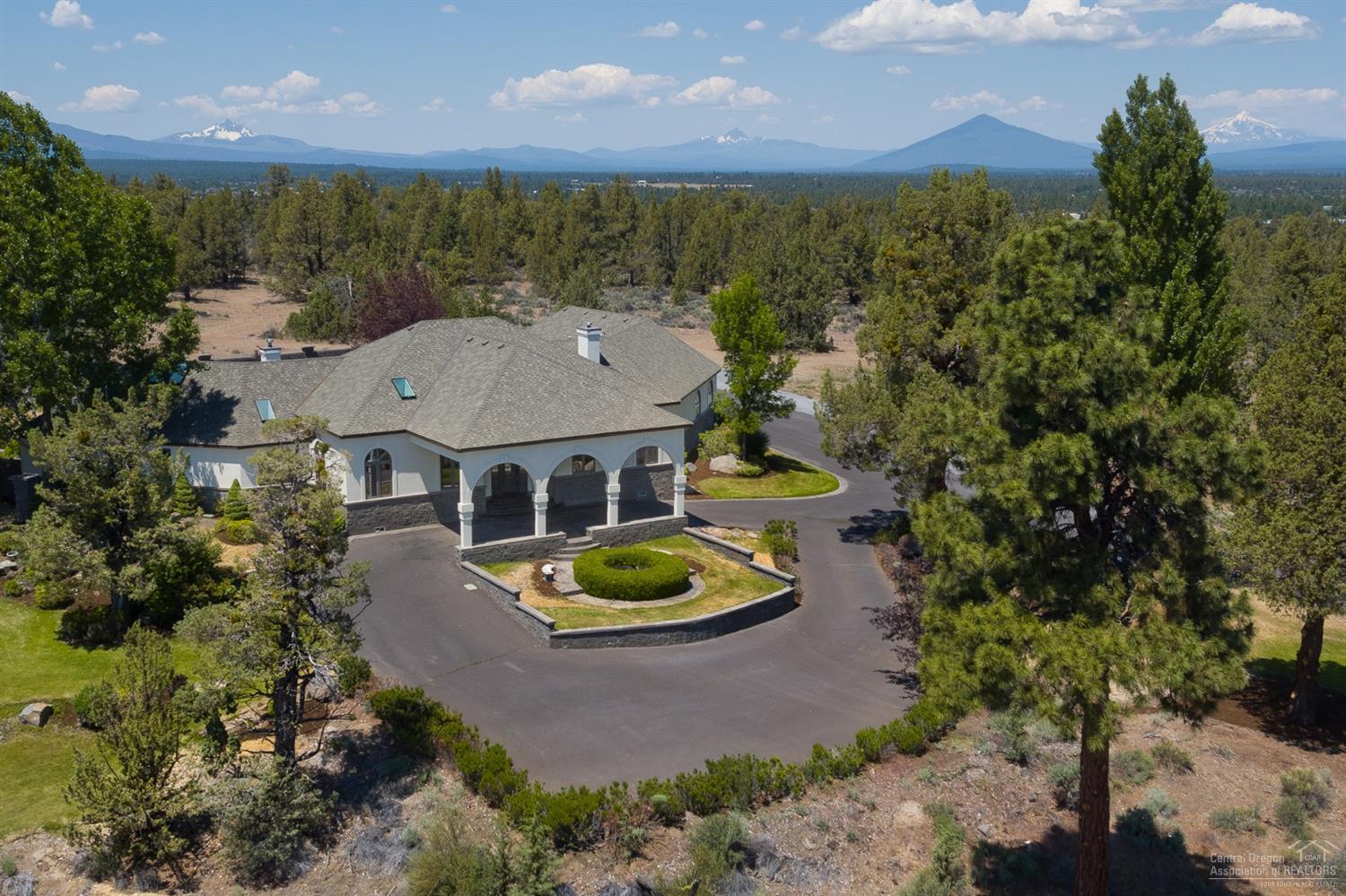 Welcome to Lion's Gate! This beautifully appointed, 50 acre custom-upgraded estate w/ breathtaking Cascade Mountain views, sitting high above its private land overlooking Tumalo farmland is the perfect place to entertain in luxury. Take a dip in the pool, relax in the gazebo or sit by the fire in the living room or master bdrm. Detached shop/3 car garage w/bathroom below the hill can accommodate RV's, additional vehicles & plenty of storage space. Recreational options abound on the estate's private acreage.