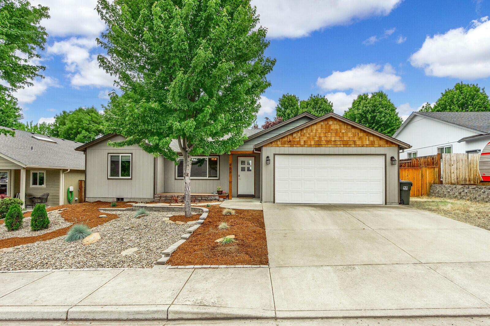 Prepare to be impressed w/this beautifully updated single level home! This home lives comfortably w/3 bedrooms, 2 baths + huge 15 X 20' bonus rm w/glass barn doors, 1,646 sqft in total. Efficiently designed split flr plan. They say the kitchen is the heart of a home...well this well appointed kitchen definitley sets the tone for this house! You'll find your family wanting to gather right here w/the lg custom 5 X 9' walnut island w/lots of seating for all. Stunning custom built & beautifully stained Clear Alder Cabinetry designed for the best use & function, all w/soft close. There's plenty of storage w/the huge pull out drawers & thoughtfully designed cabinet pull outs. Slab granite in rest of the kitchen, stainless appliances, gas range & undermount farmhouse sink. It looks & feels like a million dollar kitchen! Brand new exterior paint! New laminite flooring throughout! Backyard has storage shed, garden bed & shade trees. Inground sprinklers & fenced. Large RV pkg w/gate to the back.
