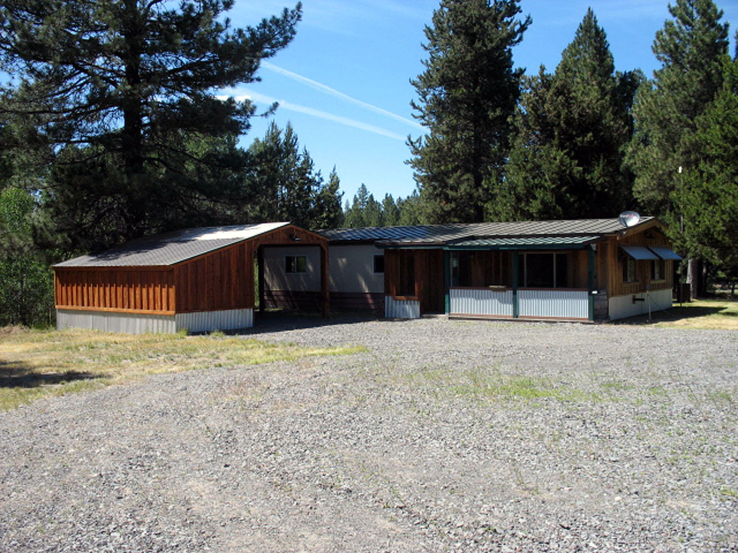 Gorgeous horse set-up, property is one of a kind! Quiet area with great mountain views!  1974 Fuqua 3 bed/2 bath manufactured home with a detached building for parking vehicles etc. Fenced dog run. Indoor Arena is approx. 98' X 60' with 220 power . Separate finished shop includes a half bath and two separate storage rooms. Approx 36' X 12' carport is attached to the side of the Arena. The covered RV building measures approx. 24' X 30'. Property is fenced and cross-fenced. Many frost-free faucets.  Ask for a copy of well log on file. The well head is on the adjacent property, close to the pump house. There is a recorded easement , Well is Not Shared.