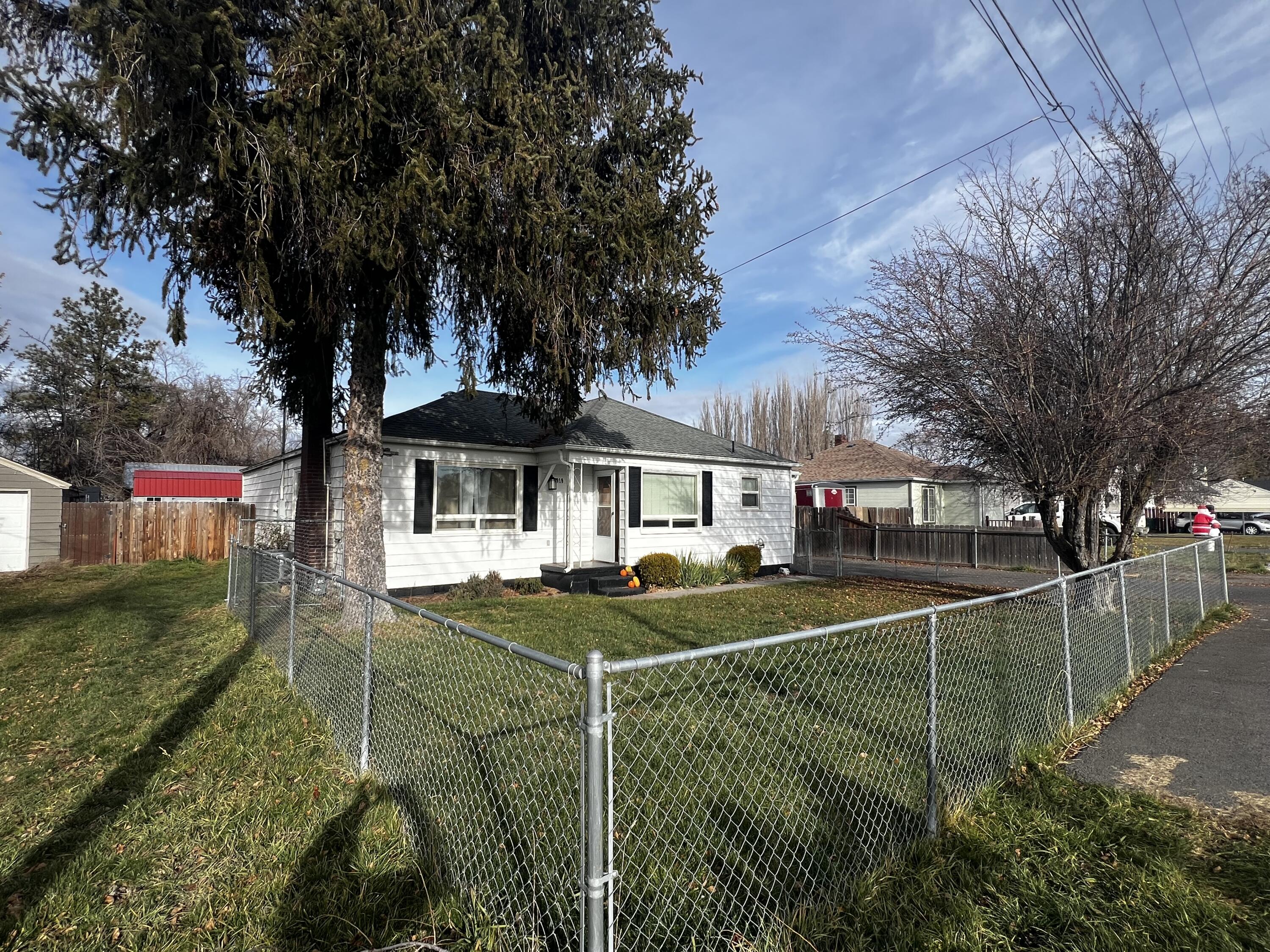 *****ASSUMABLE 3.1%*****(OAC).  
Well cared for and will not last long!  One year First American Home Warranty will transfer to buyer.
Amazing location on a very quiet cul-de-sac.  This well-maintained, move in ready 3/2 cottage-style home features numerous updates deck and AC (2022), spray-in insulation by Win-R Insulation (2024),  a 10 x 18 tuff shed (May 2023) and stainless steel appliances in kitchen.  Fully fenced  front and backyard with huge RV parking and a 3 bay, open barn. Inside features LVP throughout and professionally cleaned carpet in all 3 bedrooms and newly painted interior. Both bathrooms updated with new toilets, sinks, & lights. Large deck off the back door, ideal for outdoor entertaining with stunning sunrises, sunsets and views of Hogback Mountain. Home has access to water rights (no pump currently installed). Single car garage with entries to kitchen and back door accessible to back yard. Forced heating and air throughout.