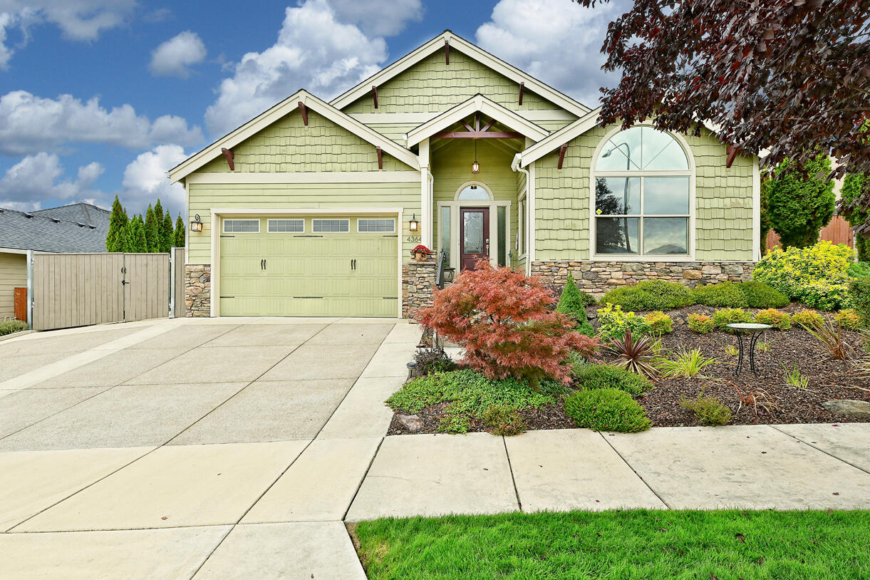 OPEN HOUSE OCTOBER 22th FROM 1 TO 4. Looking for a single level custom-built home in Vista Point in the East Medford hills of So. OR?  This open floor plan home offers beautiful wood floors and so many custom features.  Starting in the Kitchen, you will find custom live edge Rainforest Granite counters carried through on the built-in desk in the kitchen, built in shelves, and on the gas fireplace. A custom built-in office space is in one of the bedrooms with a custom made granite top desk and flanking bookcases. Heated tile flooring is in the primary bathroom, and a substantial primary bedroom with a coffered ceiling and a slider out to the backyard. A very private back patio has stamped concrete, a gas-fire table, and a lovely pergola above . A huge plus is a gated RV parking and a Garden Shed. Located across the street is the green space part of Oregon Hills Park, so no homes across the street from you. Just beautiful views! Make your appointment today or see you at the open house!