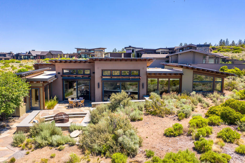 Contemporary elegance in the exclusive Westside community of Shevlin Commons. Situated on a PREMIER .37/AC lot w/unobstructed views of the Cascades and Shevlin Park, this exquisite home offers privacy, tranquility and stunning architectural details throughout. Floor to ceiling windows and doors frame Mt. Bachelor, blending indoor/outdoor living seamlessly. Natural stone and concrete wood-burning fireplace w/beam accents- truly a work of art to enjoy while entertaining in the Dining Rm or relaxing in the Great Rm. Spacious Chef's kitchen w/solid surface counters, custom fir cabinetry, Professional grade appl and built-in breakfast nook. Primary Ste features phenomenal mountain views and a luxurious bath with Mahogany soaking tub and spa-like shower. Detached Home Office + add'l Eagle's Nest office space and Media rm. Multiple outdoor patios to enjoy under the Central Oregon skies. An unbeatable location for outdoor enthusiasts and excellent proximity to Westside schools and amenities.