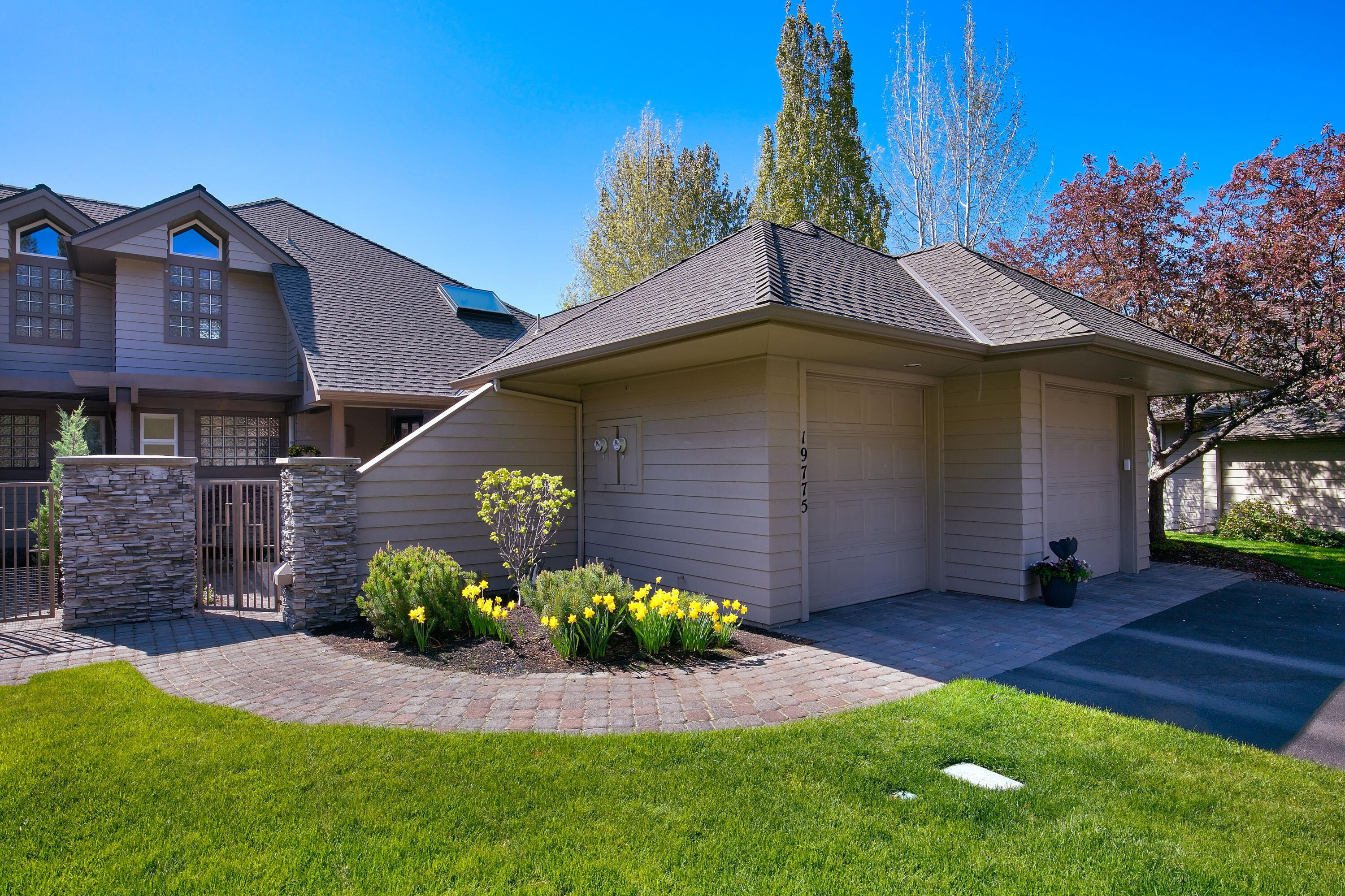 Elegance abounds from this luxurious home located on a private bluff overlooking the most stunning, panoramic views of the Deschutes River in Bend. With white water glistening inches away it's a view you have to see to believe! Stroll out your front door to the Old Mill District and downtown just minutes away. Nestled in tall Ponderosa pines, this is a true sanctuary with ultimate peace and privacy. Main level living with abundant natural light. Great room with custom gas fireplace, updated kitchen with solid quartz counter, breakfast bar, SS appliances, a large office/bedroom and a sumptuous master suite with private deck. Upstairs you will find a loft area and a second spacious master bedroom with a private deck overlooking the beautiful Deschutes River. Downstairs is a large bonus room that can be used as a fourth bedroom with full bathroom and double vanity. Just steps away from the Deschutes River Trail and minutes to Mt. Bachelor Ski Resort. Truly a one-of-a-kind opportunity in B