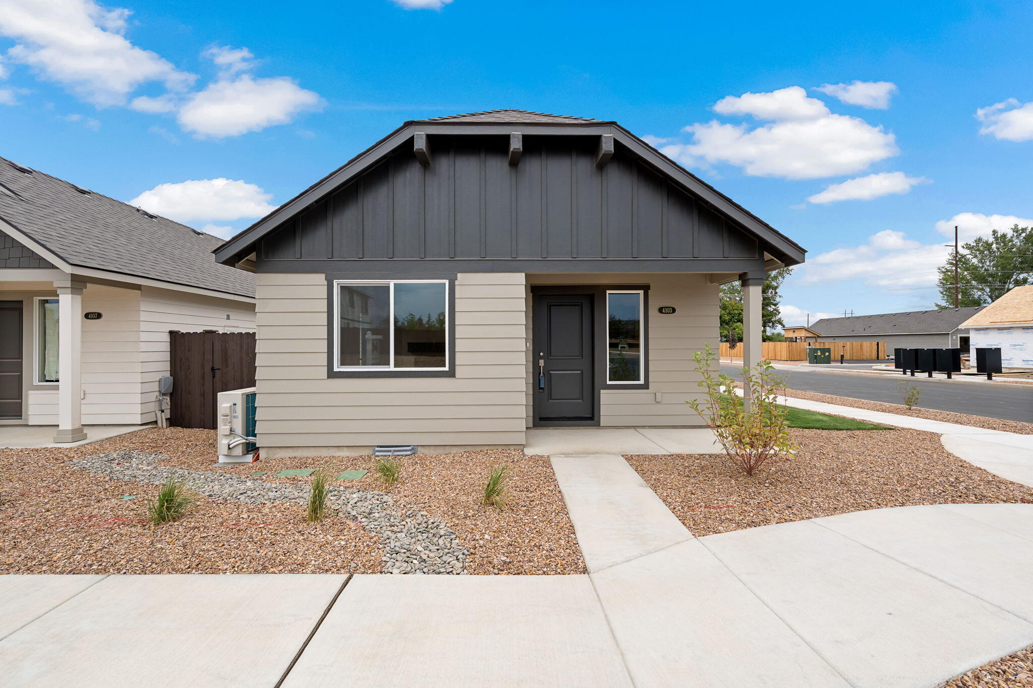 Welcome to the Florence, a single-level 3-bedroom, 2-bath home situated on a desirable corner lot in Redmond's Feather Ridge community. With 1,102 square feet of thoughtfully designed space, this home features an open-concept layout, luxury wood laminate flooring, quartz kitchen countertops, stainless steel appliances, and a spacious great room that opens to a covered front porch and rear patio. The primary suite includes a private bath, while the mudroom/laundry room offers convenient garage access. The 2-car garage and attached external storage provide additional space for everyday needs. Located near scenic parks, mountain views, and the future Redmond Recreation Center, the Florence blends comfort and style in a prime location.