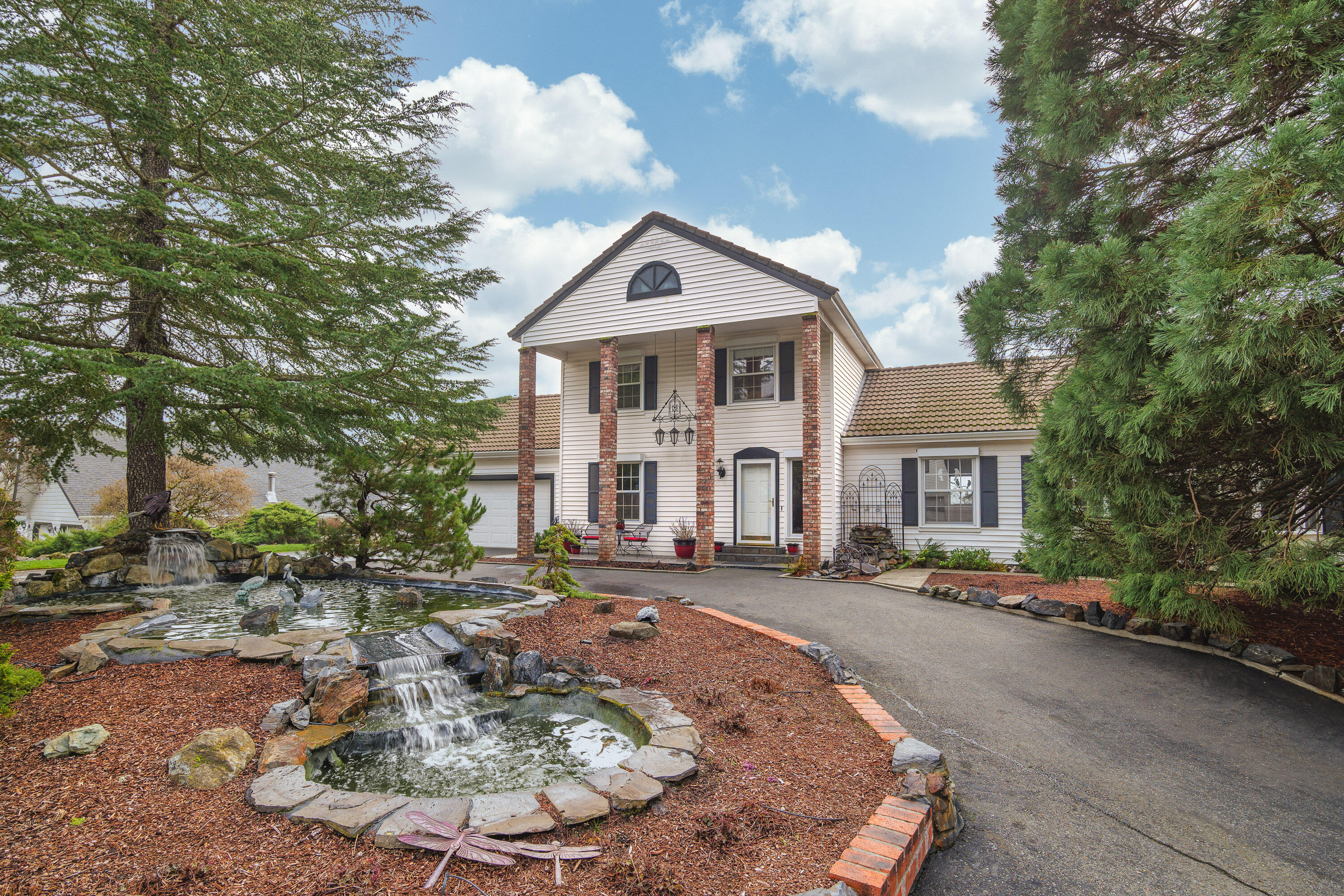 Back On Market and priced to allow for updates and/or extra savings! 
Move In Ready!  Beautiful Mountain Views! Huge shop! Pool!
This gated 1983 Colonial-style home offers 2,992+ sq. ft. of living space with sweeping valley & mountain views that will take your breath away. This 5-bedroom, 3.5-bathroom home is designed for comfort  & versatility, featuring two spacious primary suites—ideal for multi-generational living or hosting guests. An additional760+ SF   unfinished basement offers extra storage.

The back patio and pool area provide the perfect setting for relaxation and entertaining.

Car enthusiasts & hobbyists will love the incredible garage spaces, including an attached 2-car garage, a 34 x 50 garage/workshop with air compressor, and drill press, and an additional 32 x 23 garage with a loft and 3/4 bath.

This gated property combines privacy, stunning views, and incredible amenities. Don't miss the opportunity to make this exceptional home