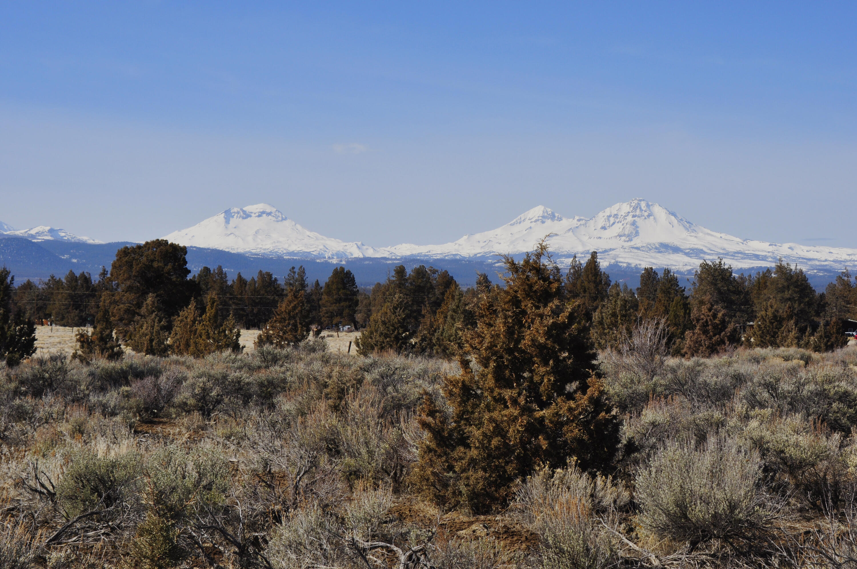 Fantastic opportunity to own 40 acres of property between Bend and Sisters with huge Cascade views. This property provides ample space for various activities and allows for privacy and tranquility. The presence of a charming cottage offers immediate accommodation options while you work on your plans to build your dream home. There is a 1248 sq ft agricultural building that can serve multiple purposes including storage, office, work shop or whatever would suit your ag needs. Living on the property while you plan your dream home gives you the advantage of experiencing the land firsthand and understanding its unique characteristics. It also allows you to take your time with the planning and design process to ensure your new home perfectly fits your vision and takes advantage of the stunning views this property offers. This property affords an ideal setting for those looking to enjoy a rural lifestyle, embrace the beauty of nature, and create their dream place.