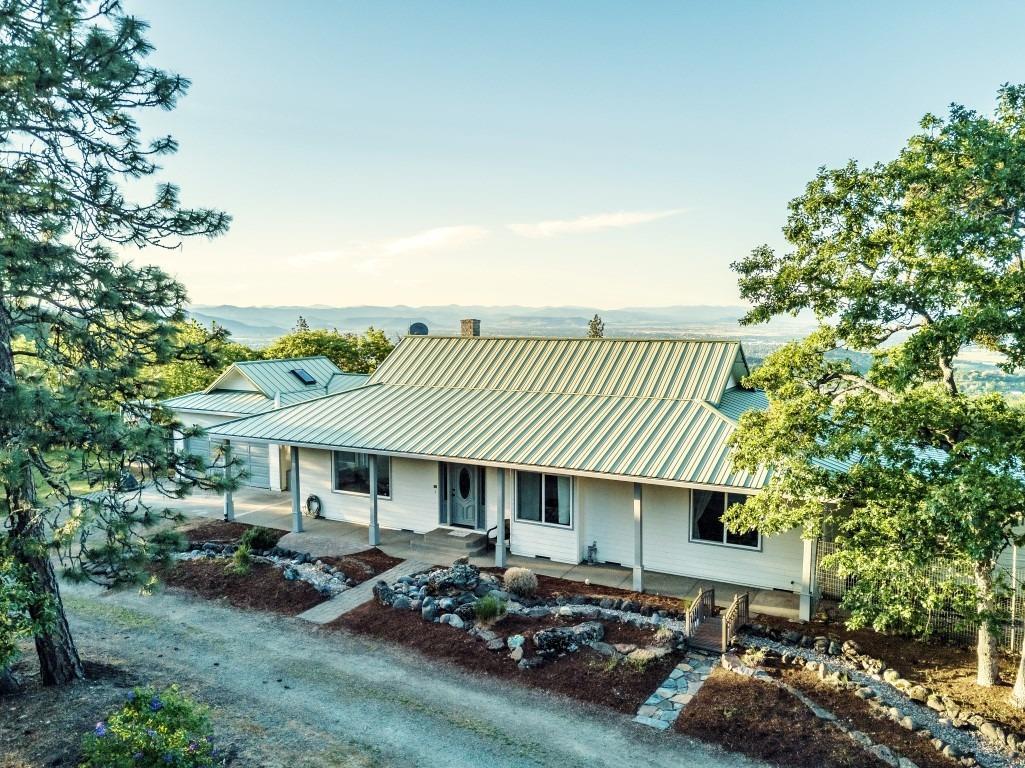 Welcome to your own personal retreat w/panoramic views! With over 17 acres you will have the privacy & space you have been searching for. Lovely single story home is light & bright with pleasing views out of every window. Spacious living room opens up into the dining room & kitchen. Kitchen features a bay of windows to take in the view, plus an island, breakfast nook & pantry; could end up being your favorite room in the house! Dining room has French doors that lead to the backyard. Large master w/on suite bathroom & French doors allows you to wake up to the views every morning. 2 nice sized guest rooms & guest bath leave room for everyone. An additional 300sqft sunroom is a great place to relax. Screened in breezeway would be a great place for year-round dining. After a long day you can sit on your back patio & enjoy your very own paradise! Detached garage & large space for an RV gives you room for all of your toys. Seasonal pond, fenced garden area & so much more!