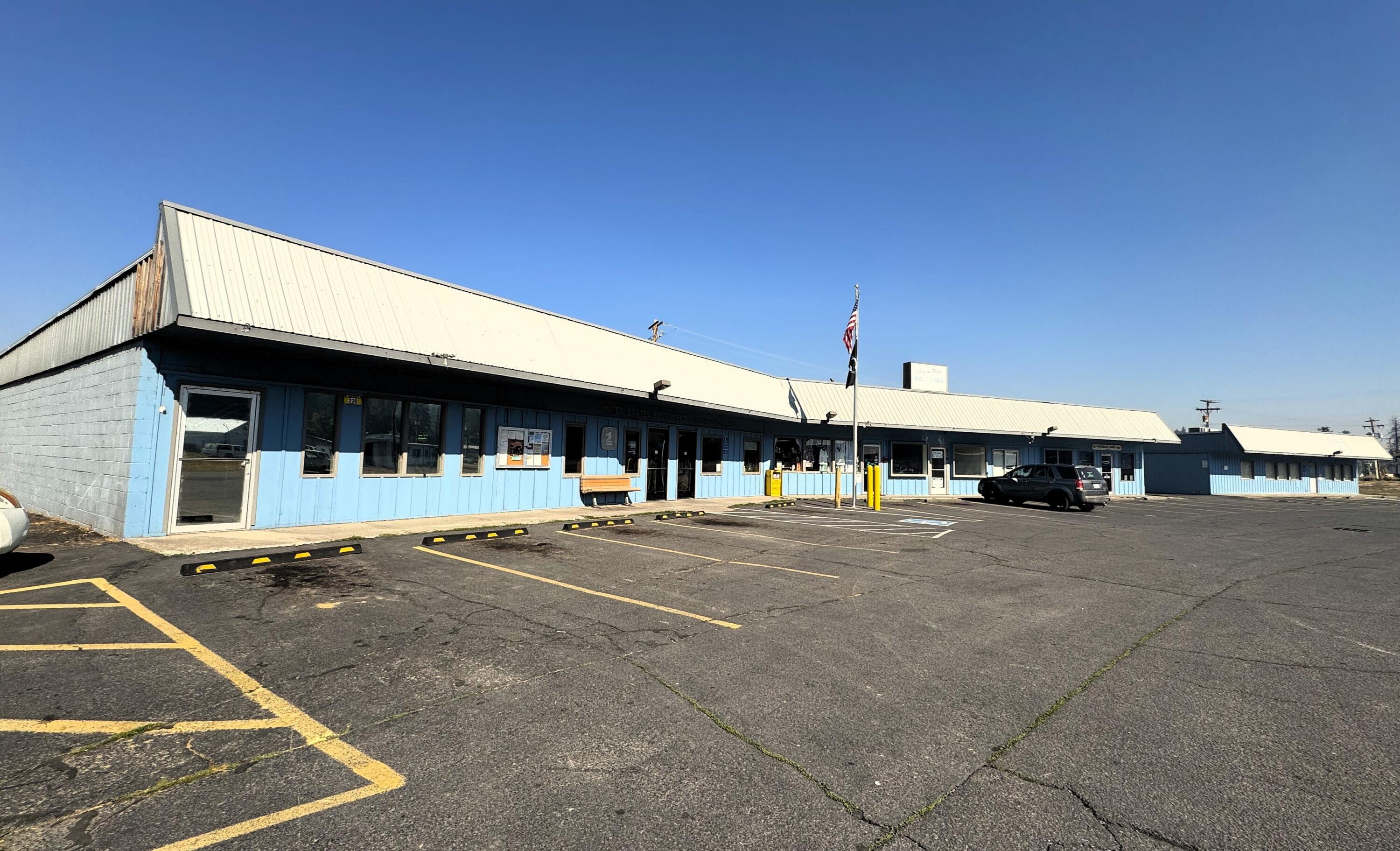 Prime Commercial Opportunity in Downtown Chiloquin! This single-level, multi-tenant strip mall features 7 total spaces, including long-term tenants including the U.S. Post Office and the popular Potbelly Cafe. Also included is the stand-alone building at the end of the strip mall and ready for new tenants—ideal for retail, office, or service businesses. Located in the heart of downtown Chiloquin with a dedicated parking lot, good visibility, and steady traffic. Great investment or owner-user opportunity in a Southern Oregon rural community. Sale includes two vacant lots on the north side of the mall and 1 vacant lot on the south side for a total of 10,000 sq ft building on 1.4 acres.