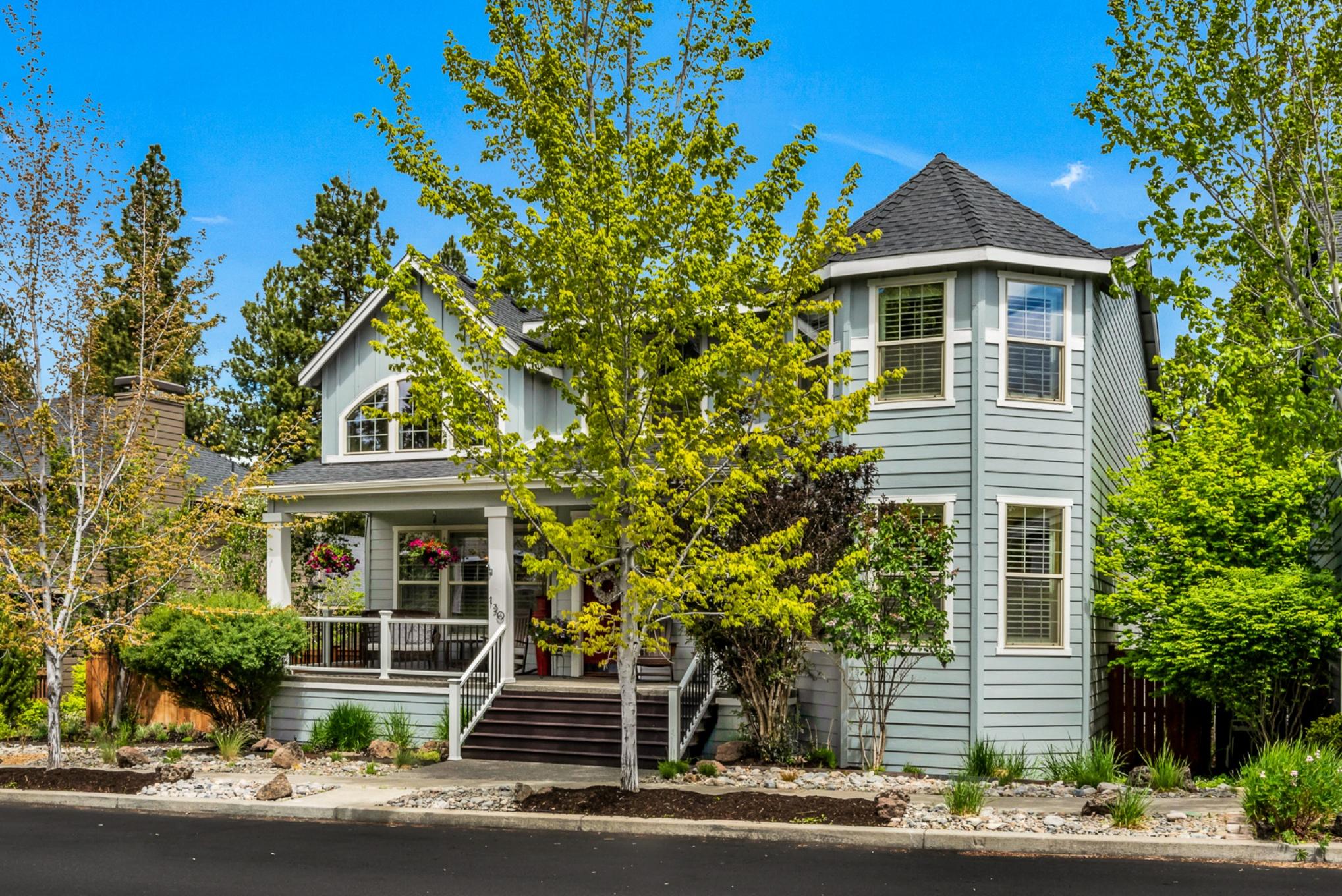 Uniquely situated amongst a serene tableau of tall pines, greenspace & peekaboo Mt. Bachelor views, this spacious home features amenities galore! The inviting floorplan is designed for entertaining, featuring great room w/cathedral ceilings, two dining areas + breakfast bar for six, open kitchen featuring S/S appliances + pantry, two master suites (one on the main level), generous upstairs living/flex room & new plantation shutters throughout. Boasting a low-maintenance fenced yard, thoughtfully designed outdoor living spaces include a stunning Mahogany arbor, Trex deck featuring wood-burning oven (perfect for pizza parties), flagstone patio (w/hot tub wiring nearby) & custom hops trellis.  Grow your own produce in the community garden/park located directly behind this home, which has alley access to the 858SF, 35' RV/triple-car garage w/30 amp RV power. Close to all Bend's westside hot spots, trails, river, schools & recreational opportunities beckon to come live the Bend lifestyle!