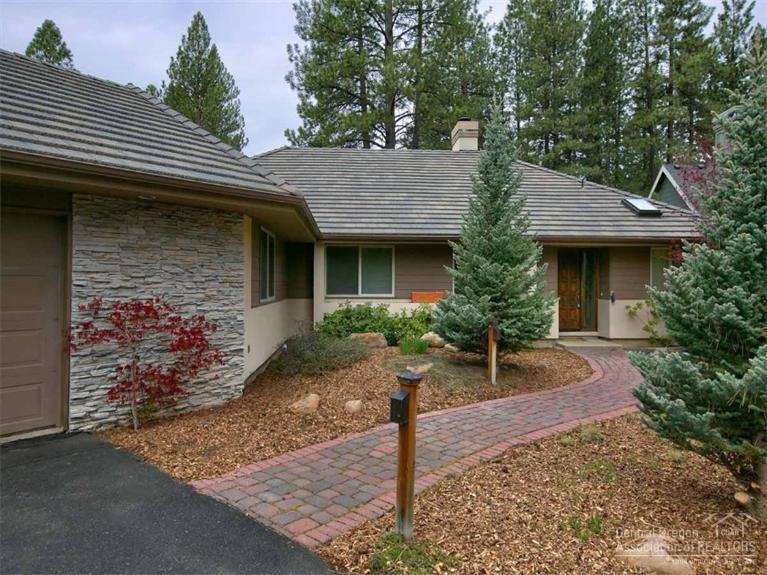 Nice single level home backs to the Widgi Creek golf course. Open floor plan with a fireplace, big windows and wet bar in the living area. The kitchen features a propane cook top, double ovens and tile counters. Formal dining room plus a breakfast nook. The spacious master suite has two walk-in closets, a spa tub and step-in shower. There are two decks - one off the living area to sit and enjoy the view and a separate deck located off the kitchen. Big .47-acre lot with easy-care natural landscaping.