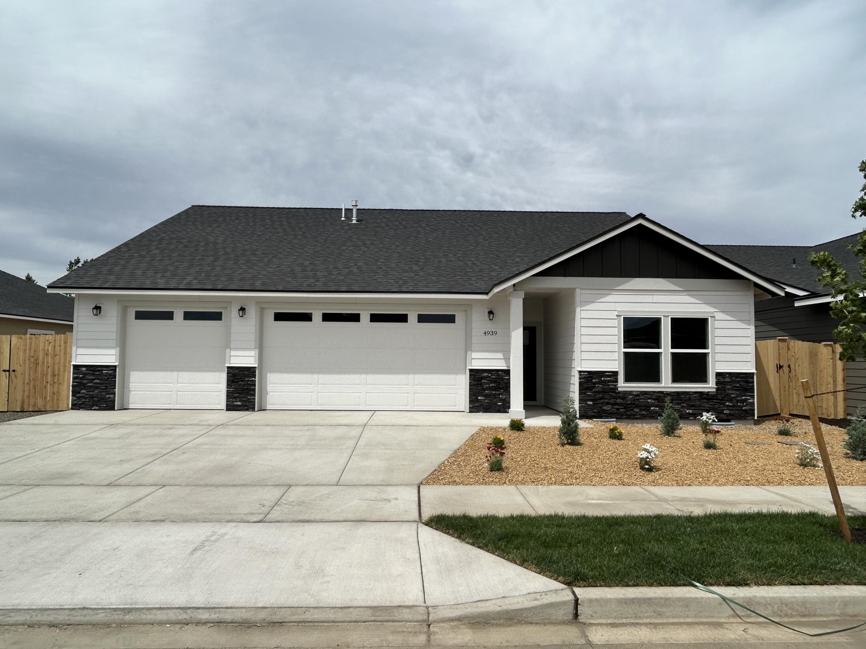 Welcome to Korbin Meadows, Phase 2, a new community in desirable neighborhood of SW Redmond. Lot 25 features the Berkley floorplan w/ 1,813 sf w/ single level living; 3 bdrms, 2 1/2 baths and 3 car garage. Primary bdrm features a walk-in closet, dual vanity with enclosed toilet & shower. Great separation from two guest bedrooms sharing a full bathroom with tub/shower combo. Entertain in your kitchen w/ SS appliances, walk-in pantry, tiled backsplash, extensive slab quartz countertops opening to dining area and great room w/ decorative gas burning fireplace. A utility/laundry room too! Durable laminate plank flooring thru-out & carpeted bdrms. Fenced yard & landscaping w/ sprinklers, RV/boat parking & entrance gate. Upgraded finishes & A/C included! Estimated completion June 2024.*Floorplan & rendering subject to change.