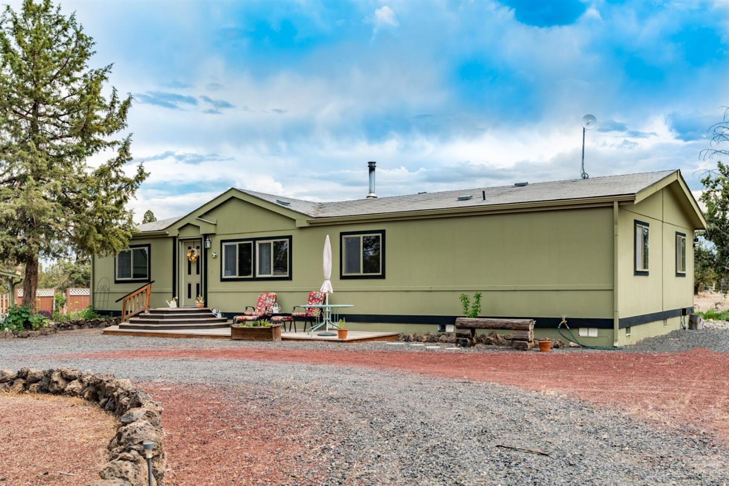 Well maintained manufactured home on 4.76 acres. 720 ft. private well. Lots of out buildings, plenty of storage. Close to BLM/ATV.