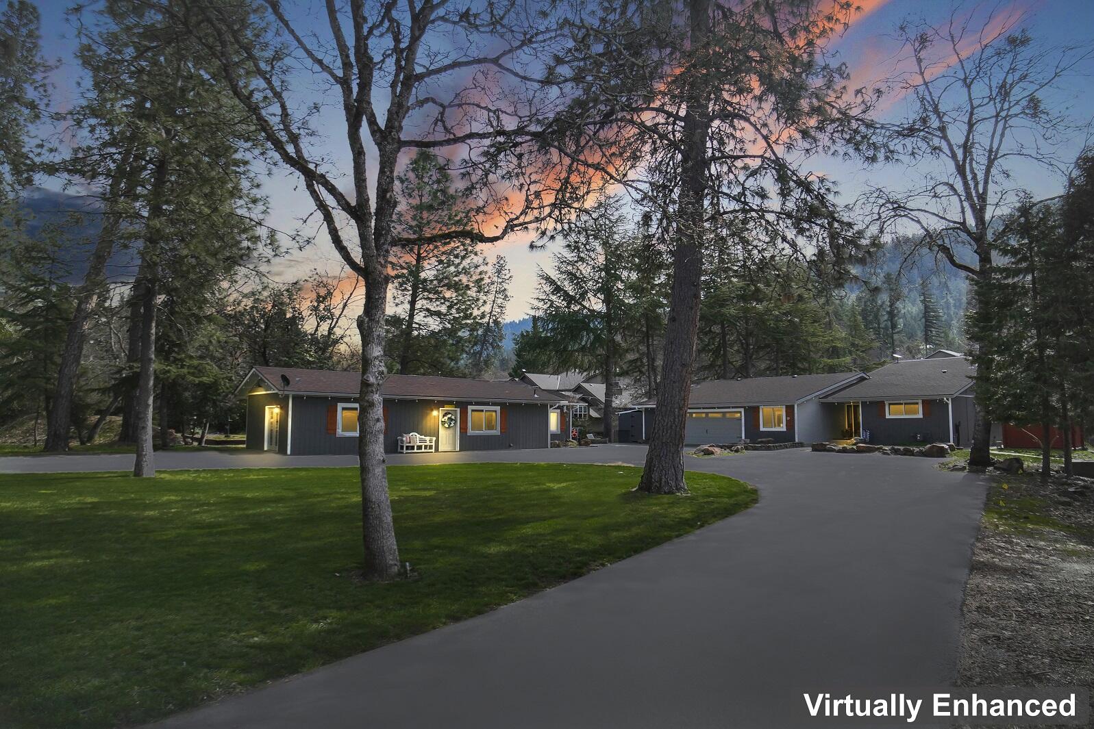 Situated in one of the most Heavenly & Magical settings you will ever find on the Rogue River.  A true fisherman's dream spot located in one of the most desired quiet Cul-de-sac neighborhoods away from freeway noise.  Top to bottom renovations completed 2023, 2 homes on 1 lot includes 3 Bedroom single level home plus additional 2-bedroom 1 bath home. Gorgeous custom gourmet kitchen with 5 burner stove, farmhouse vent top and stainless appliances.  INDOOR heated swimming pool.  No expense was spared in these beautiful turnkey homes which come completely furnished.  New roof, new HVAC and electrical.  Additional attached shop area in garage, plus 2 bonus areas for tools/toys.  Plus, out-building for more storage.  Irrigation water rights from the river. Automatic sprinkler system.  Enjoy relaxation time in the Spa, gazebo and firepit or fish to your hearts content.  Minutes from town and restaurants. Live in one and rent other.