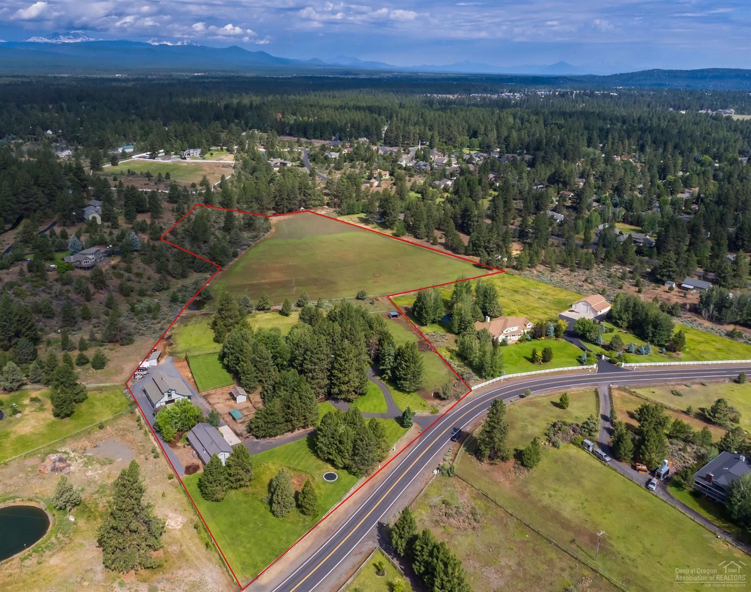 SUBDIVIDABLE! Enchanted craftsman style home, 4 bedrooms, 3.5 baths flowing floor plan, exceptional light and spacious views of tailored grounds. Perfect for indoor and outdoor entertaining. This highly sufficient 13-acre property is fully equipped with underground sprinklers on which 11 acres are irrigated with Arnold water rights. Luxury six stall barn with automatic waters in each stall. Wash room, tack room and upstairs 800 sq. ft office/studio and bathroom with heater and ac unit. Separate full functioning shop and RV bay, 2 car garages with connected guestroom, office and full bathroom. Sports field, firepit, horseshoe pit and lined recreational pond. This gated and horse ready property is an opportunity where timeless memories are made, and the values of your legacy will be celebrated.