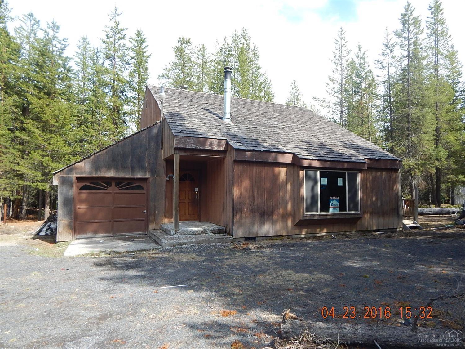 Cabin in the Woods? This little beauty is just off Hwy 58 in Crescent Lake. 2 level cabin with attached single garage plus detached garage, wrap around deck, woodstove in living room, vaulted ceilings on nicely wooded lot. Great value for this size home with 3 bedrooms and 2 full baths! Sold AS IS, seller will make no repairs.
