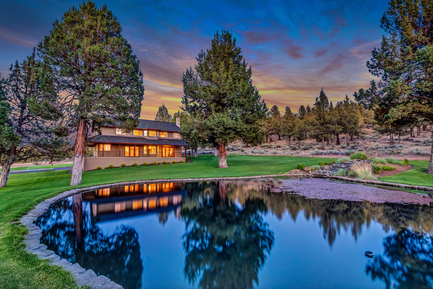 2 TAX LOTS w/potential for future development! Gorgeous, lightly lived-in custom home on private setting w/panoramic Cascade Mt views close to BLM. Seller spared no expense in creating the perfect park-like Oasis! Oversized 3-car garage w/new epoxy flooring, plus fabulous detached shop w/2 big bays. Meticulously maintained home w/spacious country kitchen, formal dining room, breakfast nook & inviting living room w/ wood burning FP. Upstairs boasts master suite w/ stunning views, luxurious master bath & 2 walk-in closets. Additional 2 bedrooms adjoined by jack-and-jill bathroom. Enormous lower-level bonus space accessible from inside home, as well as exterior. Charming wrap-around porch to enjoy the gorgeous setting & views. New roof on house & shop in 2019. 2 Heat pumps to service each floor, providing efficient heating & cooling, 2 Hot water tanks & high R-Value insulation throughout, including garage. View attached 3-D Interactive Virtual Tour to see all of this & more!