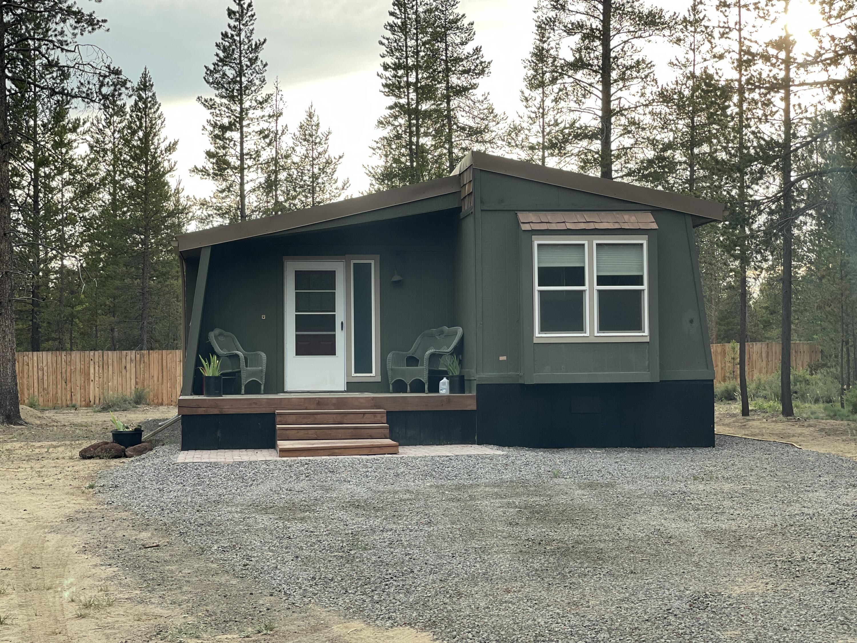 Charming and updated 1977 manufactured home on a spacious city lot in the heart of La Pine! This well-maintained home blends vintage character with modern upgrades, offering 2 bedrooms, 2 bathroom, and a bright, open living space. Recent updates include new flooring, fresh paint, and updated fixtures throughout. Outside, enjoy two outbuildings, a lot of open space to develop a garden, play, or relax. Conveniently located near local shops, restaurants, and schools—this home offers comfort and affordability with city utilities and easy access to Hwy 97. Call your favorite agent come and see today!