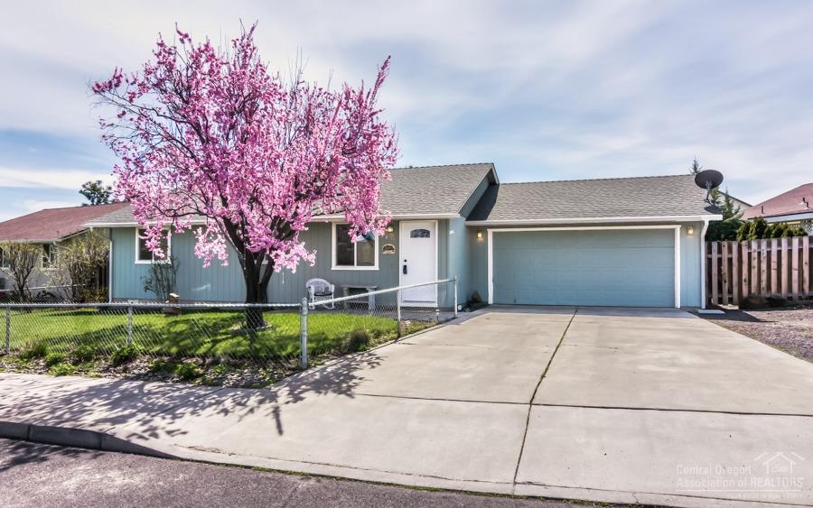 First Time Home Buyer / Investment Property! Wonderfully maintained and updated home with landscaped backyard privately guarded by mature trees and shrubs. The lilacs will amaze when in bloom and fresh apples from your own trees are a treat. This delightful home has an open floor plan with three bedrooms, two baths, two car garage, and hard to find RV Parking. The backyard deck is an extension of the home with a full size solar shade. DETAILS: 3 bed, 2 bath, 1008 sqft, .14 acres, built 1994. Updates include; solar tube, paint, water heater, painted cabinets, Antique Hickory Laminate, carpet, and vinyl. Parking; double garage, RV, concrete driveway. Exterior: Large backyard and deck with solar shade, shed (12x16), landscaped, fenced, sprinkler. Includes; murphy bed, refrigerator, washer, dryer, microwave, dishwasher, range/oven.