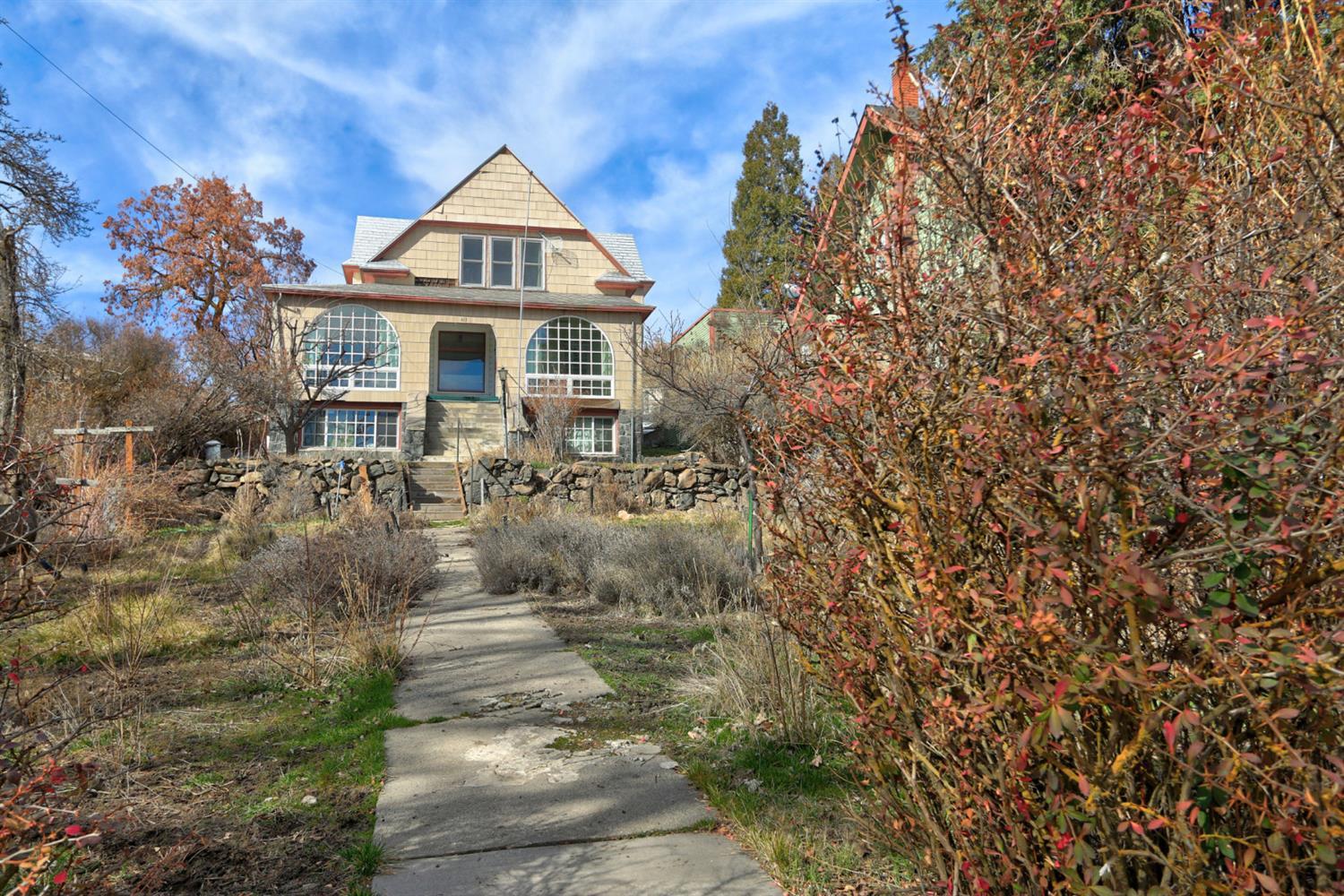 Over 2000 sq foot Victorian style home. 4 bed, 1 1/2 bath project home. Priced @ just under $75 per sq foot. Seller had to move, is out of funds to continue remodel. Great Opportunity for a fixer! Home is situated on a street to street lot! Parking is in back of home.