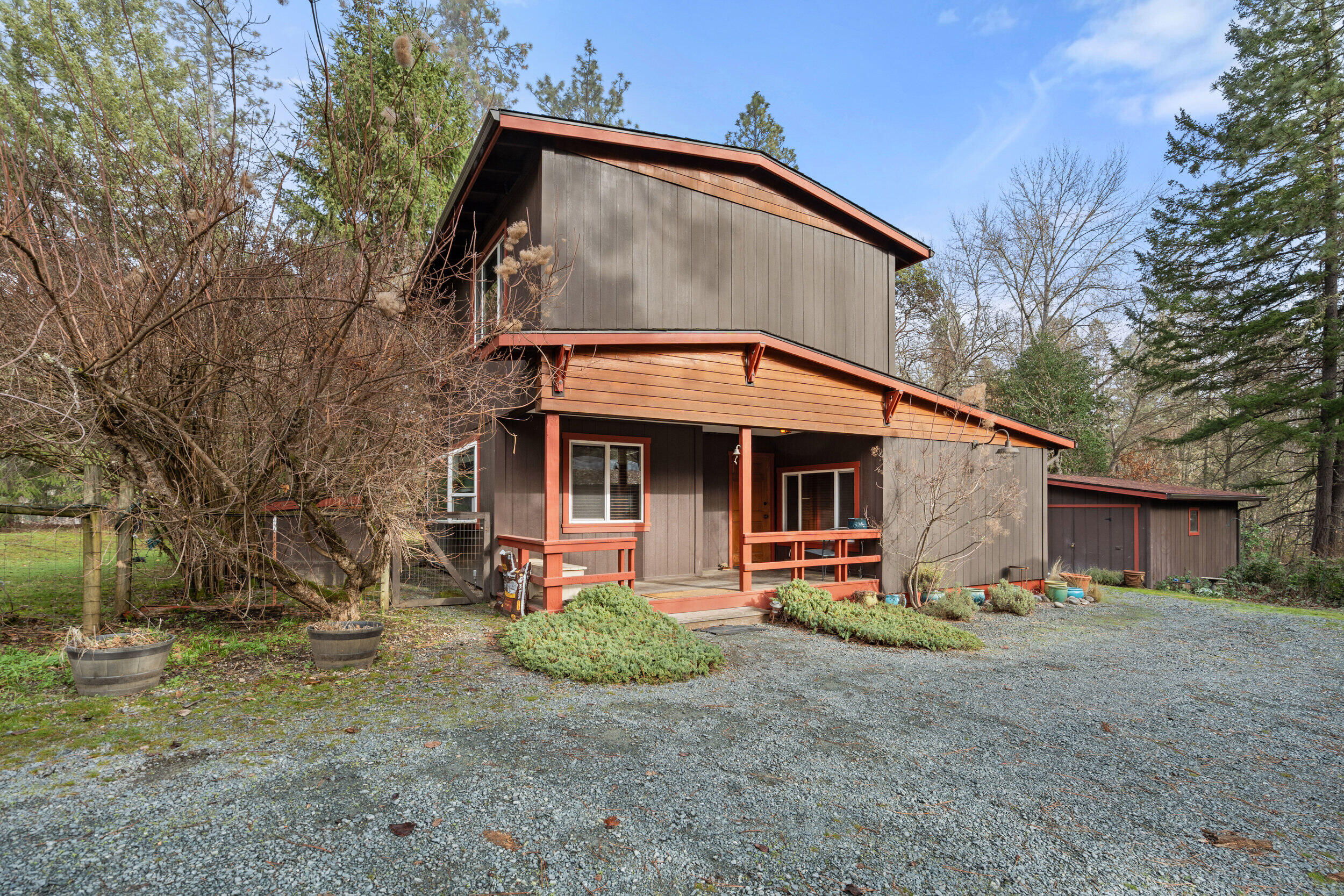 Enjoy peaceful country living in this charming Foots Creek property, where space, privacy, and versatility come together. The 1,558 sq ft home offers 3 comfortable bedrooms and 2 full baths, providing a functional layout for everyday living or hosting guests. A 720 sq ft shop/garage with a second story adds incredible flexibility—ideal for a home office, artist studio, workshop, or hobby space. Don't forget to click on the video! 
Outdoors, you'll appreciate the 2 large sheds and carport, offering abundant covered storage for vehicles, tools, or recreational equipment. The flat, fully usable 0.67-acre parcel provides endless possibilities to garden, play, or expand, all while enjoying the quiet and beauty of the surrounding countryside. Conveniently located just a short drive to Grants Pass or Medford, with the mighty Rogue River nearby for fishing, rafting, and outdoor adventure, this property delivers the perfect balance of rural living, accessibility and affordability.