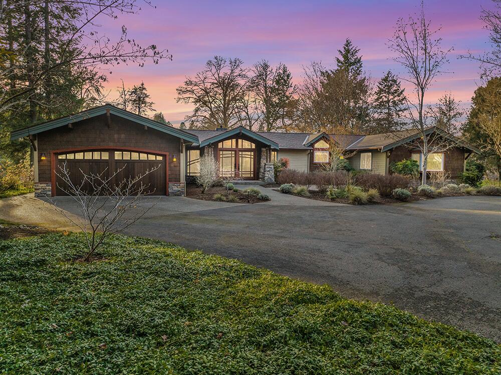 Amazing River Home. This stunning Contemporary Craftsman home offers 1.5 acres of serene riverfront living on the Rogue River. Fully remodeled and updated in 2006, this single-story retreat spans 2,841 sq. ft. and features 3 bedrooms, 2.5 baths, and breathtaking river views. Inside you'll find Brazilian Cherry hardwood floors, Heart of Fir trim, Two cozy fireplaces, and a whole-home speaker system that create a warm, sophisticated ambiance. The custom kitchen boasts maple cabinetry, granite counters, a Viking gas range, wall ovens, a custom tile backsplash, and a center island, perfect for creating memorable meals. In the large primary suite there's a large walk-in closet, Soaker Tub, Large Shower, & French doors out to the patio overlooking the river. Step onto the covered stone patio and take in the beautifully landscaped grounds and the tranquil sound of the riffle. With a newer roof, whole-house generator, and end-of-the-road privacy, this is an exceptional riverfront sanctuary.