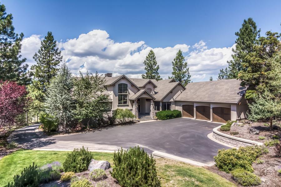 The highest quality material and million dollar views captured in every living space, come together to create one of Awbrey Butte's most desirable masterpieces. Nestled amongst mature landscaping & old growth timber, you will enjoy seclusion, expansive outdoor living spaces & larger than life panoramic views. Expansive and open floor plan features oversized picture windows that capture natural light, & all main level living. Centered on a chef's kitchen, main level also includes formal dining, executive office, & deluxe master suite. Home highlights exotic tile, slab granite, custom cabinetry, real wood accents, and custom finishes throughout. Upstairs features 2 separate en-suites with downstairs having second great room, wine area and 4th bedroom. Impeccably maintained for the discerning buyer with quick access to shopping and dining. Full appraisal completed 12/19/18, report valued home at $1,750,000.
