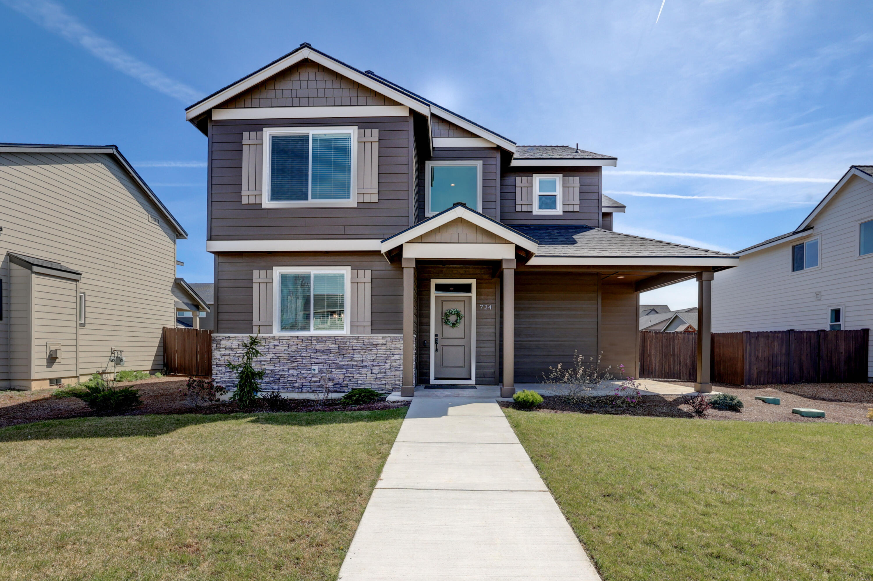 Nestled in a desirable neighborhood, with grid-tied solar for inexpensive electric bills! The 7.2 kilowatt system has 18 panels and generates around 10,000 kwh/yr. Since installed they have only paid the $12/month for electric (saving about $125/month).  This home has 4 bedrooms & 2.5 baths, providing space for relaxation and entertainment.  The well-appointed kitchen features modern appliances, ample counter space, and a breakfast bar, making meal preparation a delight.  The spacious living area is bathed in natural light, creating a warm and inviting atmosphere for gatherings with family and friends.  Enjoy cozy evenings by the fireplace or step outside to the private patio and landscaped backyard, perfect for outdoor dining and recreation.  Conveniently located near schools, parks, and dining options, this home offers easy access to everything Redmond has to offer.  Great proximity to outdoor attractions like Smith Rock State Park and the Deschutes River,